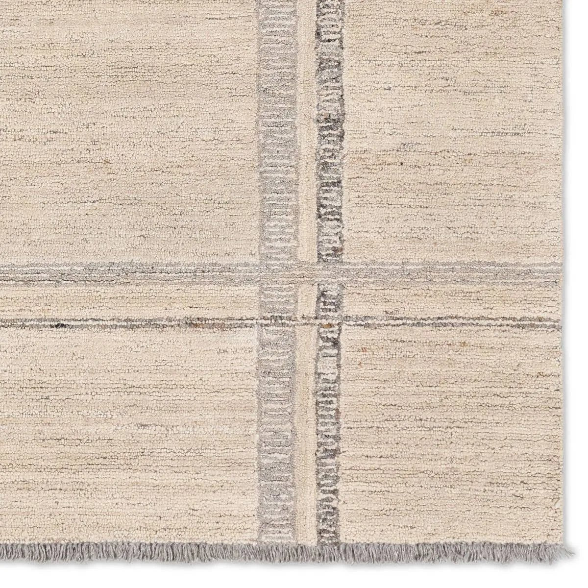 Featuring Hadi Bilal Rug by Jaipur Living at Amethyst Home. The hand-tufted Hadi Bilal introduces fresh looks inspired by modern Moroccan patterns and neutral colorways. The Bilal design features a trellis with geometric detailing, encompassing North African styles in cream and gray hues. Short, gray fringe and 100% wool pile adds to the global appeal. . Amethyst Home provides interior design, new home construction design consulting, vintage area rugs, and lighting in the Winter Garden metro area.