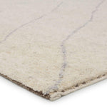 Rich in detail and plush underfoot, the Indira Laverna is made up of neutral-toned modern Moroccan styles. The Laverna area rug features a slight sheen and luxurious hand-knotted construction of natural wool and viscose. A light trellis design provides geometric interest in a silver-blue hue on a soft ivory backdrop. Amethyst Home provides interior design, new home construction design consulting, vintage area rugs, and lighting in the Calabasas metro area.