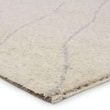 Rich in detail and plush underfoot, the Indira Laverna is made up of neutral-toned modern Moroccan styles. The Laverna area rug features a slight sheen and luxurious hand-knotted construction of natural wool and viscose. A light trellis design provides geometric interest in a silver-blue hue on a soft ivory backdrop. Amethyst Home provides interior design, new home construction design consulting, vintage area rugs, and lighting in the Calabasas metro area.