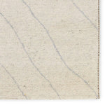 Rich in detail and plush underfoot, the Indira Laverna is made up of neutral-toned modern Moroccan styles. The Laverna area rug features a slight sheen and luxurious hand-knotted construction of natural wool and viscose. A light trellis design provides geometric interest in a silver-blue hue on a soft ivory backdrop. Amethyst Home provides interior design, new home construction design consulting, vintage area rugs, and lighting in the Nashville metro area.