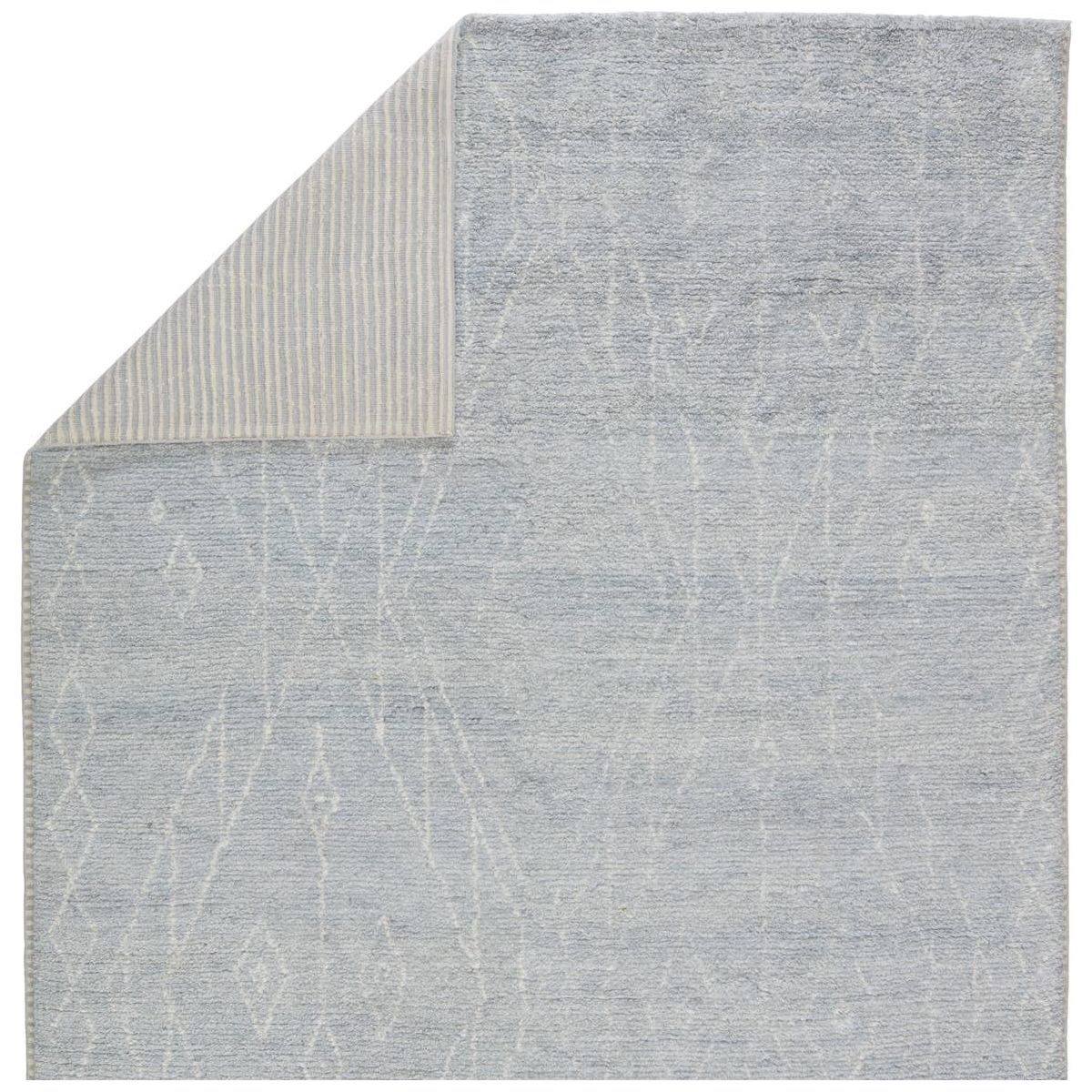 Featuring Indira Ristra Hand-Knotted Rug by Jaipur Living at Amethyst Home. Rich in detail and plush underfoot, the Indira Ristra is made up of neutral-toned modern Moroccan styles. The Ristra area rug features a slight sheen and luxurious hand-knotted construction of natural wool and viscose. A soft trellis design provides geometric interest in an ivory hu. Amethyst Home provides interior design, new home construction design consulting, vintage area rugs, and lighting in the San Diego metro area.