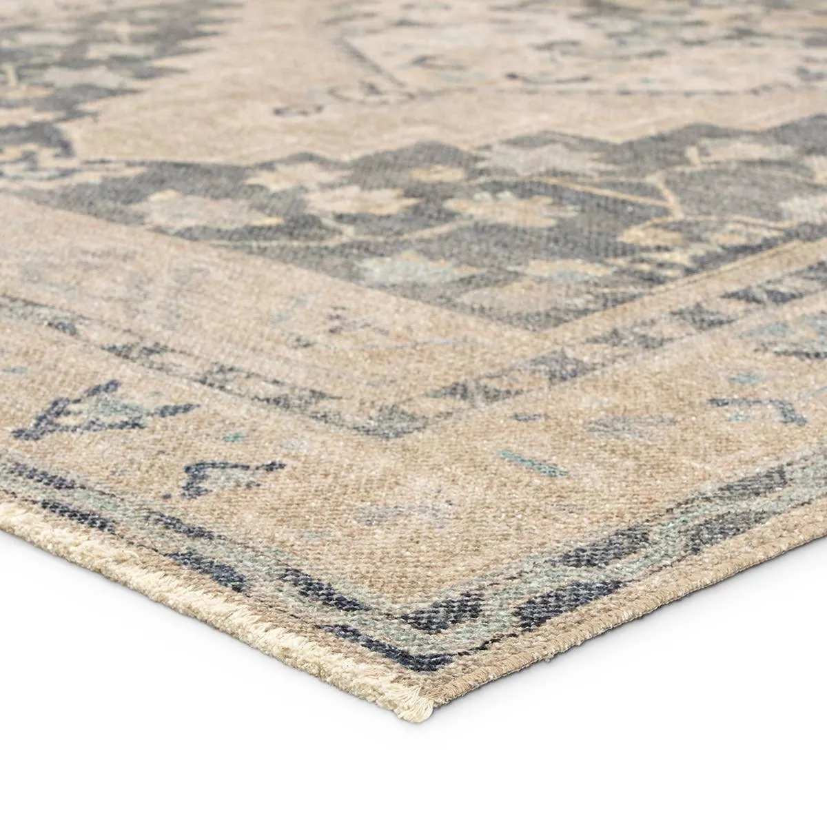Distressed, vintage designs offer an elevated tone for the Lumal Collection. The Pasin rug features an updated traditional inspired medallion and multiple floral borders in tones of navy, light green, cream, gray, and tan. This machine washable rug is stain resistant and easy to clean, perfect for homes with children and pets. Amethyst Home provides interior design, new home construction design consulting, vintage area rugs, and lighting in the Des Moines metro area.