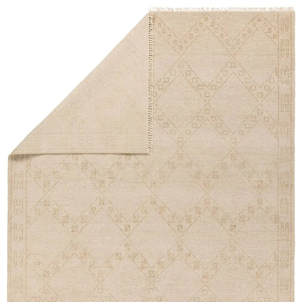 Featuring Merzouga Milada Hand-Knotted Rug by Jaipur Living at Amethyst Home. A stunning array of globally inspired designs in neutral tones define the handknotted Merzouga by Heja Home Milada. The Moroccan-inspired Milada design showcases geometric diamond pattern in cream and tan tones. The wool pile is soft underfoot and inherently stain-resistant. Han. Amethyst Home provides interior design, new home construction design consulting, vintage area rugs, and lighting in the Kansas City metro area.