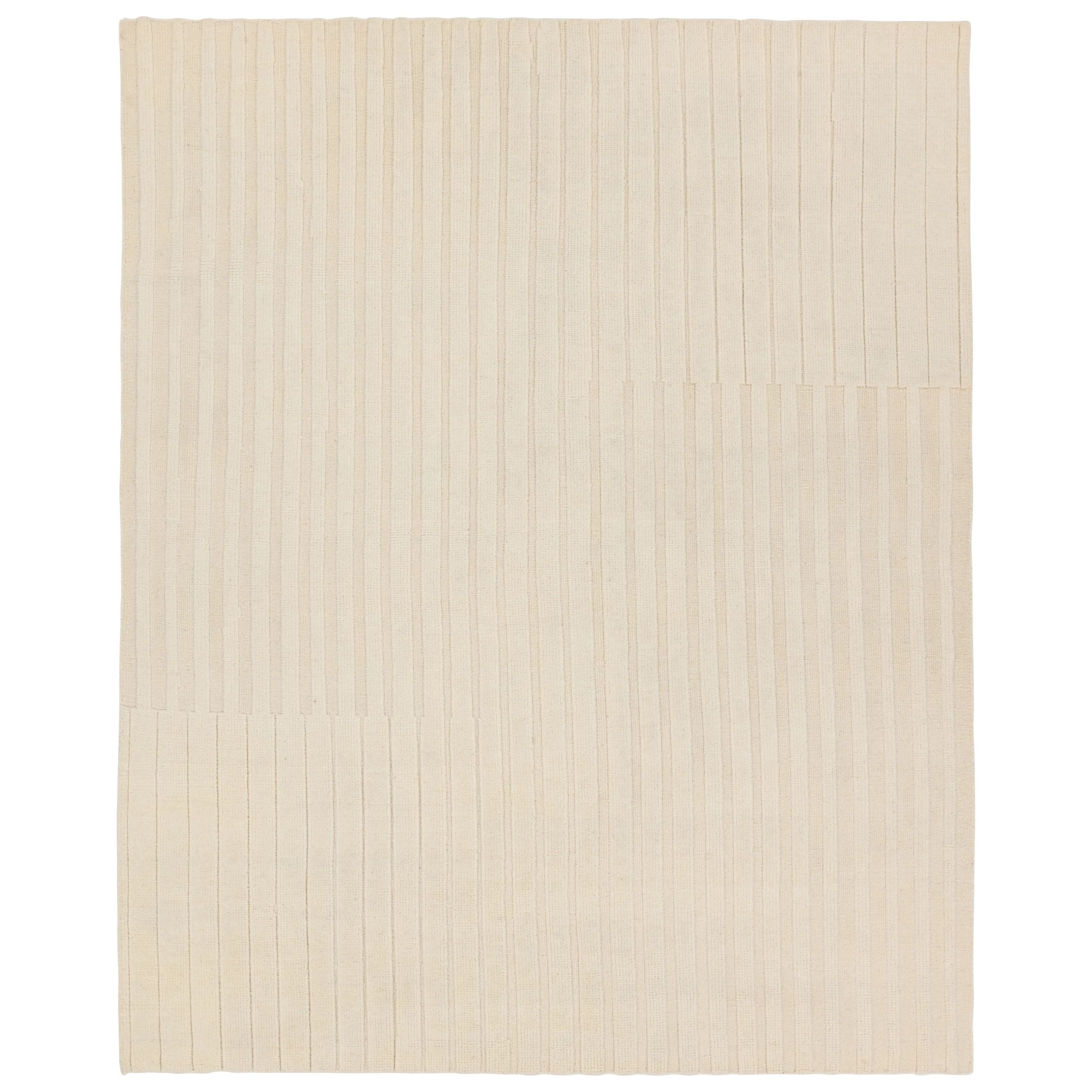 The stunning Modo collection features a statement of modernity in an artisan-crafted quality. This hand-knotted wool rug showcases a compelling textural linear motif and luxurious white colorway. Varied stripes created by cut and loop pile define the Brida area rug. Amethyst Home provides interior design, new home construction design consulting, vintage area rugs, and lighting in the Alpharetta metro area.