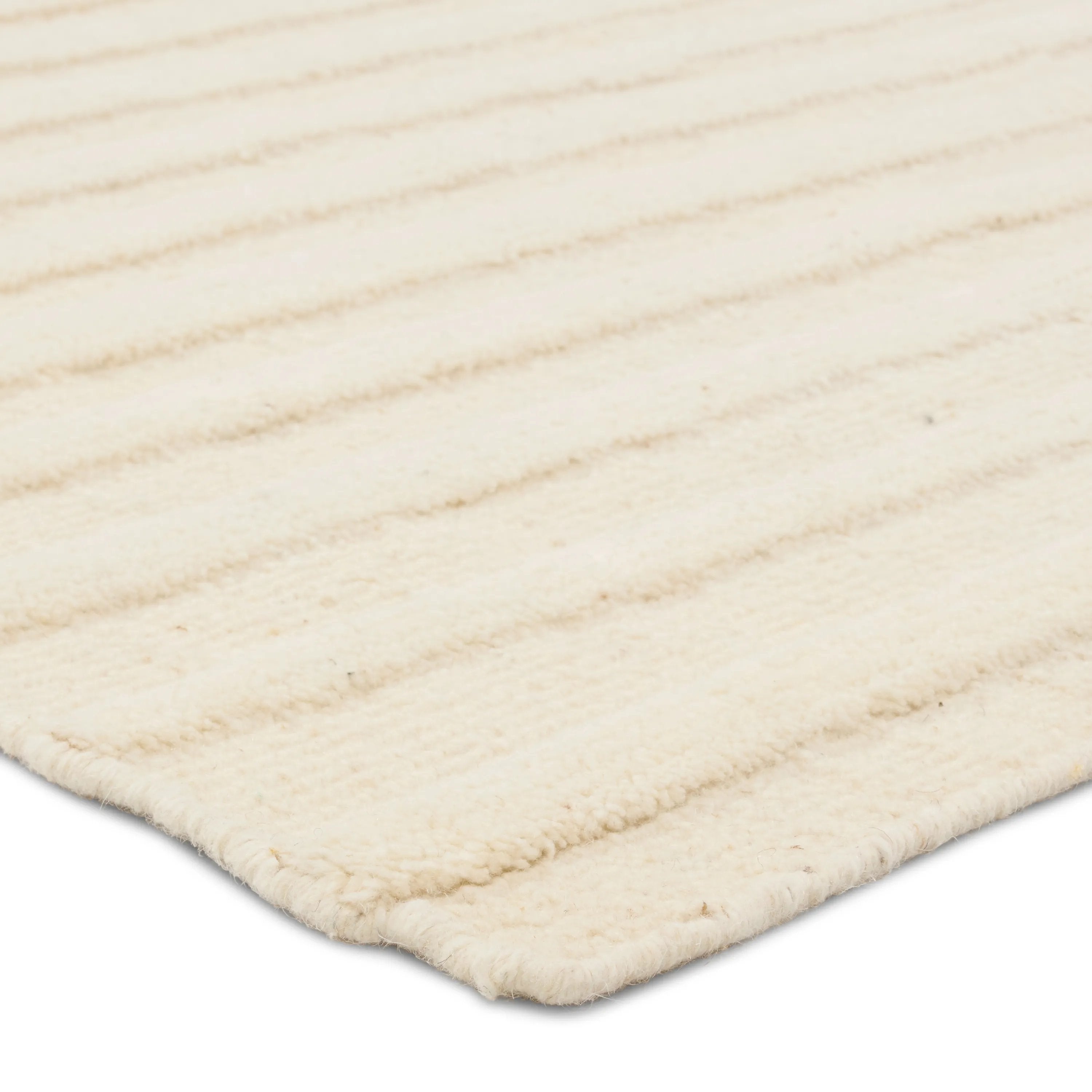 The stunning Modo collection features a statement of modernity in an artisan-crafted quality. This hand-knotted wool rug showcases a compelling textural linear motif and luxurious white colorway. Varied stripes created by cut and loop pile define the Brida area rug. Amethyst Home provides interior design, new home construction design consulting, vintage area rugs, and lighting in the Salt Lake City metro area.