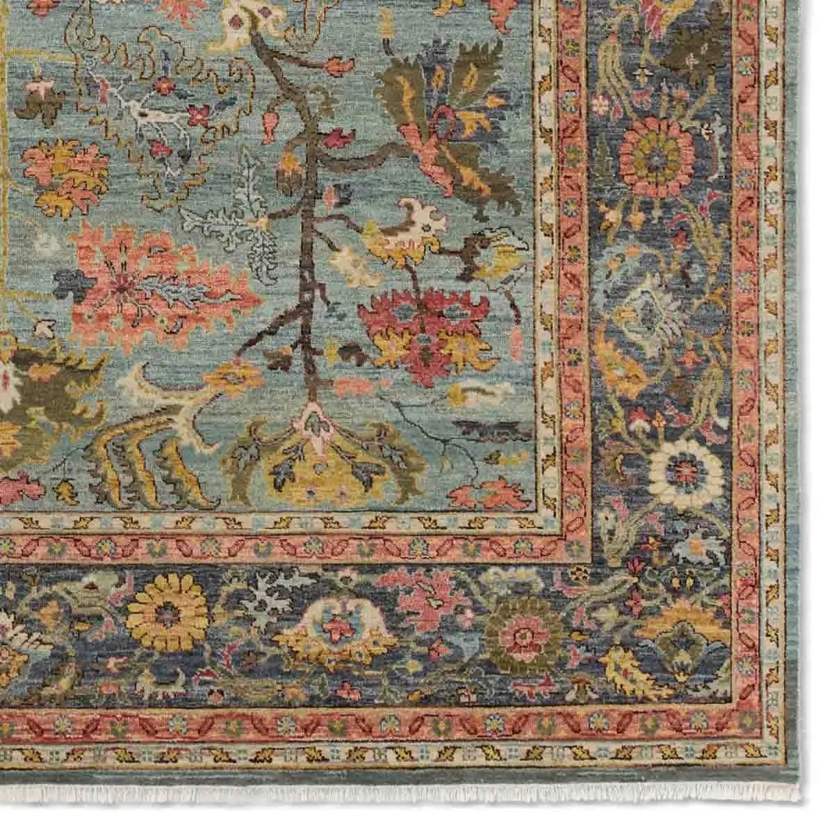 A bold colorway, high knot-count, and intricate designs define the handcrafted Novalie collection. The Elwood design features a medallion with sprawling florals and an intricate border. The blue, pink, green, gold, and gray colors provide visual intrigue and an updated traditional style. Amethyst Home provides interior design, new home construction design consulting, vintage area rugs, and lighting in the Newport Beach metro area.