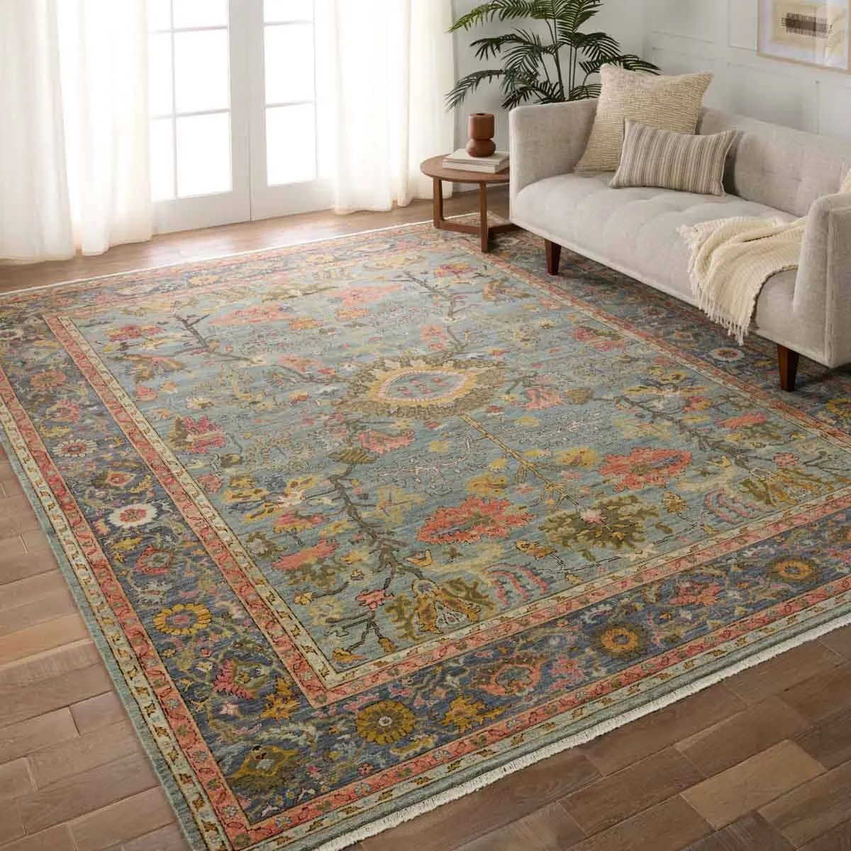 A bold colorway, high knot-count, and intricate designs define the handcrafted Novalie collection. The Elwood design features a medallion with sprawling florals and an intricate border. The blue, pink, green, gold, and gray colors provide visual intrigue and an updated traditional style. Amethyst Home provides interior design, new home construction design consulting, vintage area rugs, and lighting in the San Diego metro area.