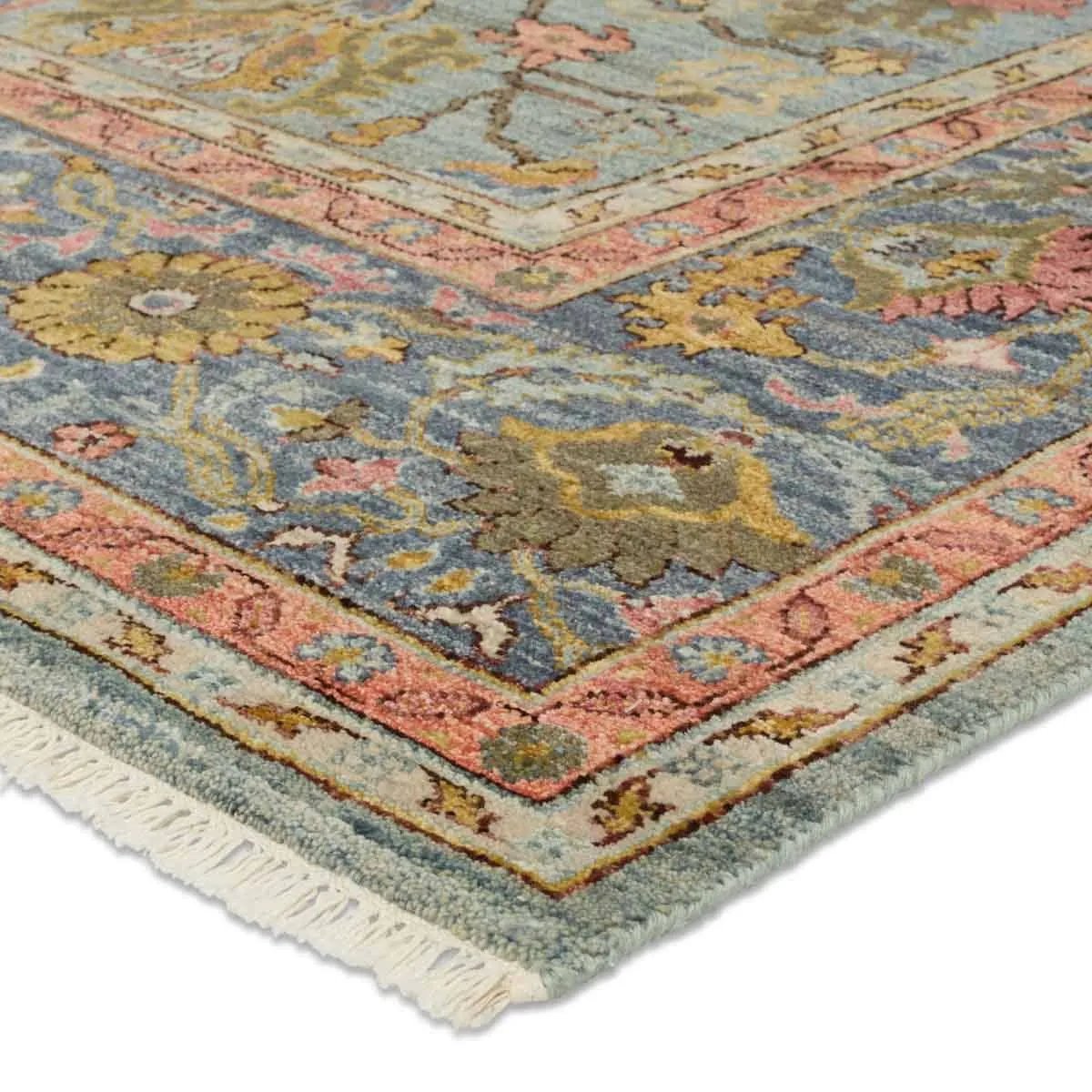 A bold colorway, high knot-count, and intricate designs define the handcrafted Novalie collection. The Elwood design features a medallion with sprawling florals and an intricate border. The blue, pink, green, gold, and gray colors provide visual intrigue and an updated traditional style. Amethyst Home provides interior design, new home construction design consulting, vintage area rugs, and lighting in the Scottsdale metro area.