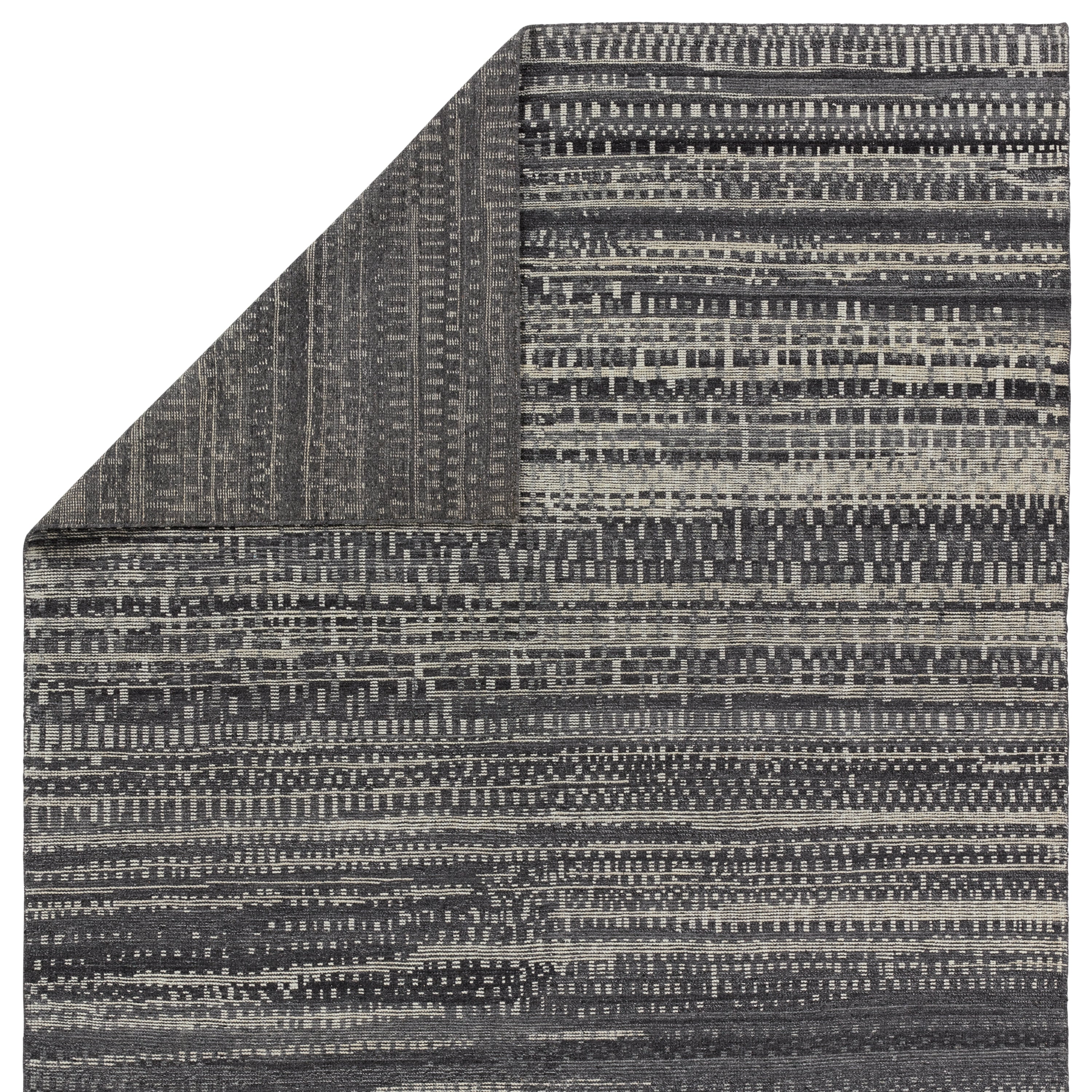 The Rize collection offers intricate and delicately designed global patterns to the modern home. The luxurious Jamaal area rug showcases a striped, linear motif in a classic gray, cream, and black colorway. This accent's hand-knotted wool construction ensures timeless durability and a stunning presence in bohemian spaces.  Amethyst Home provides interior design, new construction, custom furniture, and area rugs in the Calabasas metro area.