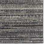 The Rize collection offers intricate and delicately designed global patterns to the modern home. The luxurious Jamaal area rug showcases a striped, linear motif in a classic gray, cream, and black colorway. This accent's hand-knotted wool construction ensures timeless durability and a stunning presence in bohemian spaces.  Amethyst Home provides interior design, new construction, custom furniture, and area rugs in the Omaha metro area.