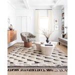 Khalid Natural/Black Rug - Amethyst Home A nod to timeless Moroccan style, the Khalid Collection is hand-knotted in India by skilled artisans. The soft pile features 100% natural, undyed wool, lending slight variations in tones that make each piece it's own. Plus, each rug is finished with a thoughtfully designed fringe.