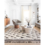 Khalid Natural/Black Rug - Amethyst Home A nod to timeless Moroccan style, the Khalid Collection is hand-knotted in India by skilled artisans. The soft pile features 100% natural, undyed wool, lending slight variations in tones that make each piece it's own. Plus, each rug is finished with a thoughtfully designed fringe.