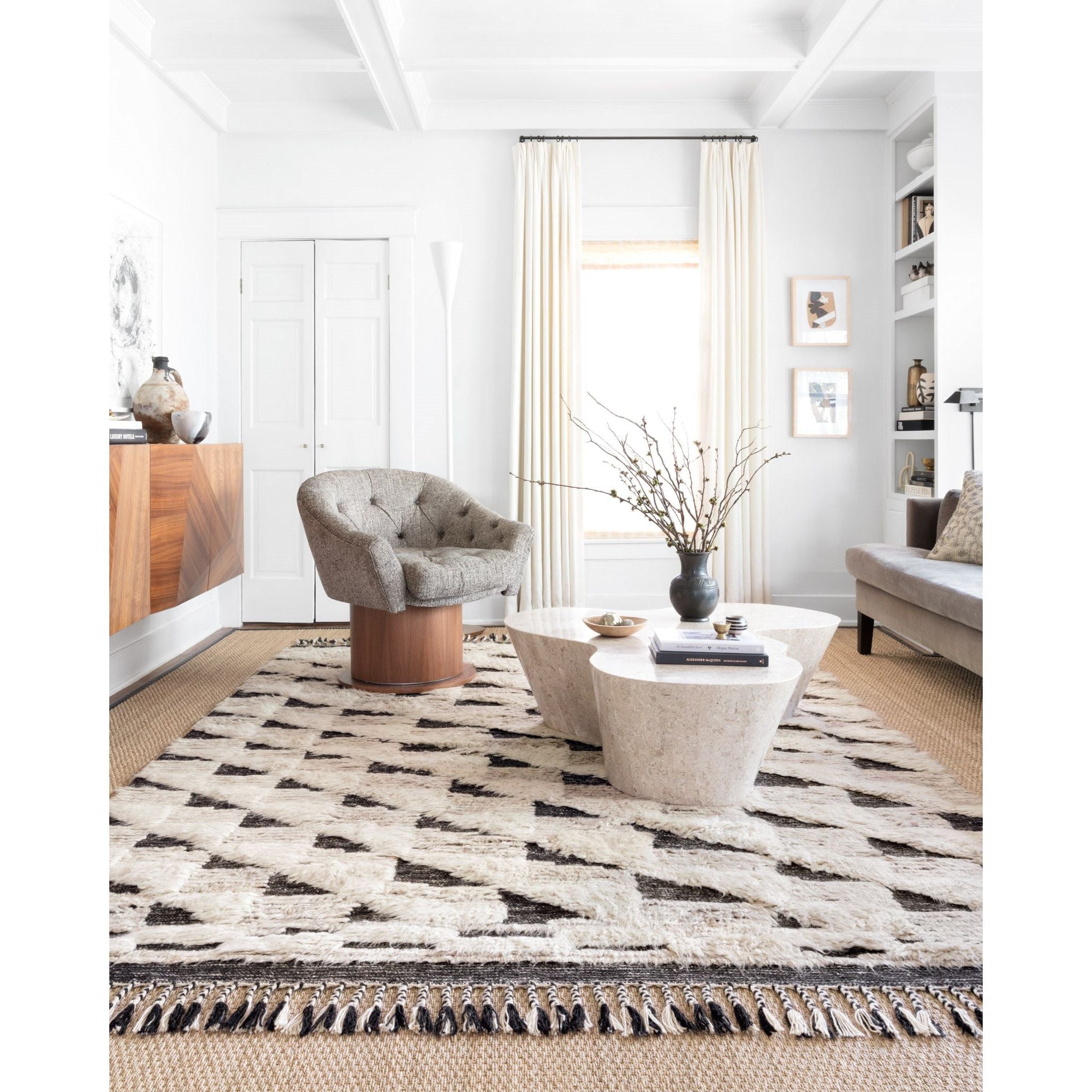 Khalid Natural/Black Rug - Amethyst Home A nod to timeless Moroccan style, the Khalid Collection is hand-knotted in India by skilled artisans. The soft pile features 100% natural, undyed wool, lending slight variations in tones that make each piece it's own. Plus, each rug is finished with a thoughtfully designed fringe.