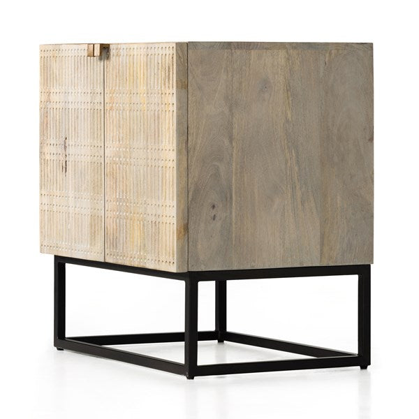 The Kelby Cabinet Nightstand adds a natural, modern feel to any space. A simple minimalist look without sacrificing storage for all your bedside needs. We love the clean lines of this piece with the intentional detailing on the front panel. Amethyst Home provides interior design services, furniture, rugs, and lighting in the Charlotte metro area.