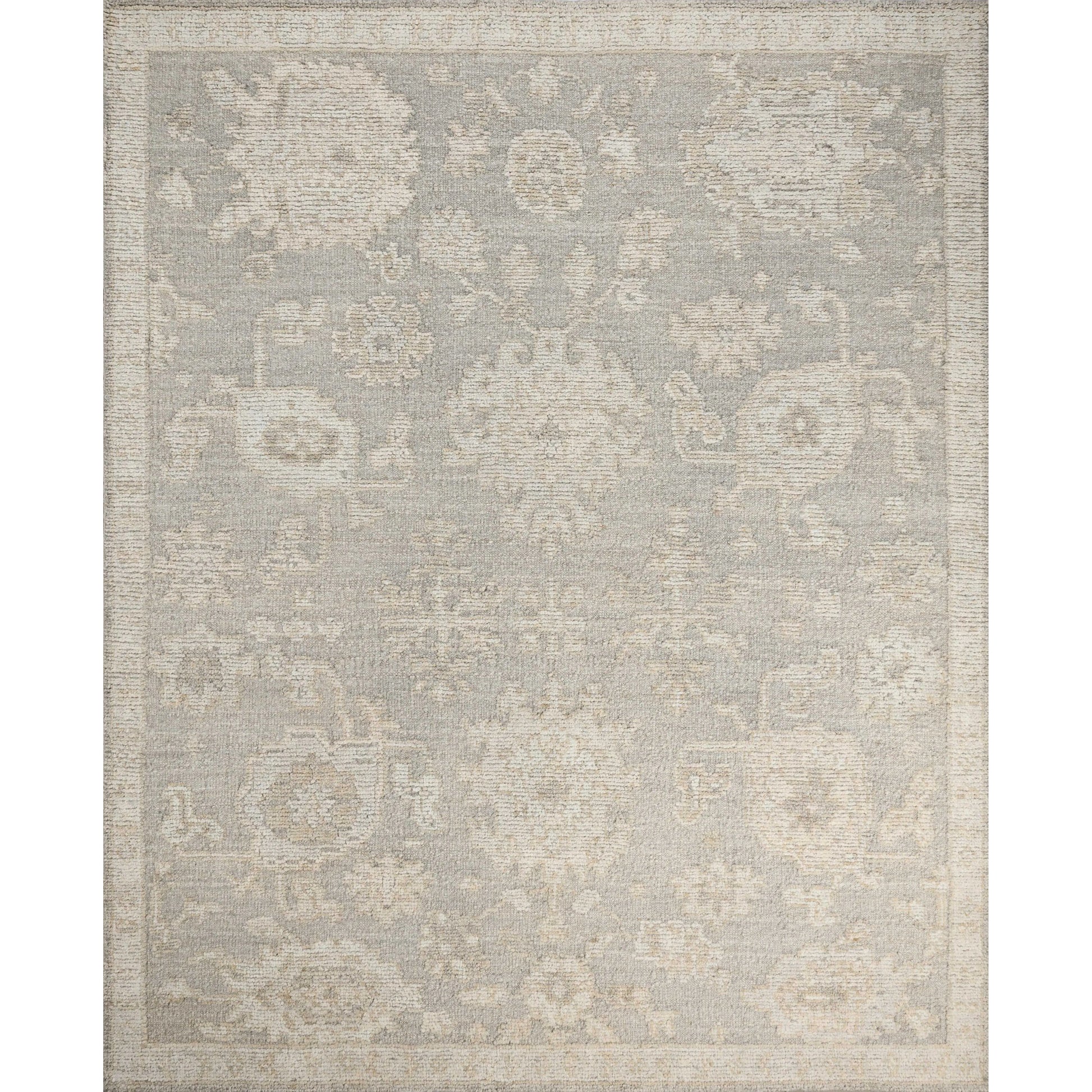 The Adelaide Collection is a cool-toned area rug with asymmetrical motifs that float across the soft wool surface. Restrained in color and dynamic in texture, Adelaideâ€™s variable pile height adds subtle dimension as the light changes throughout the day. Amethyst Home provides interior design, new home construction design consulting, vintage area rugs, and lighting in the San Diego metro area.