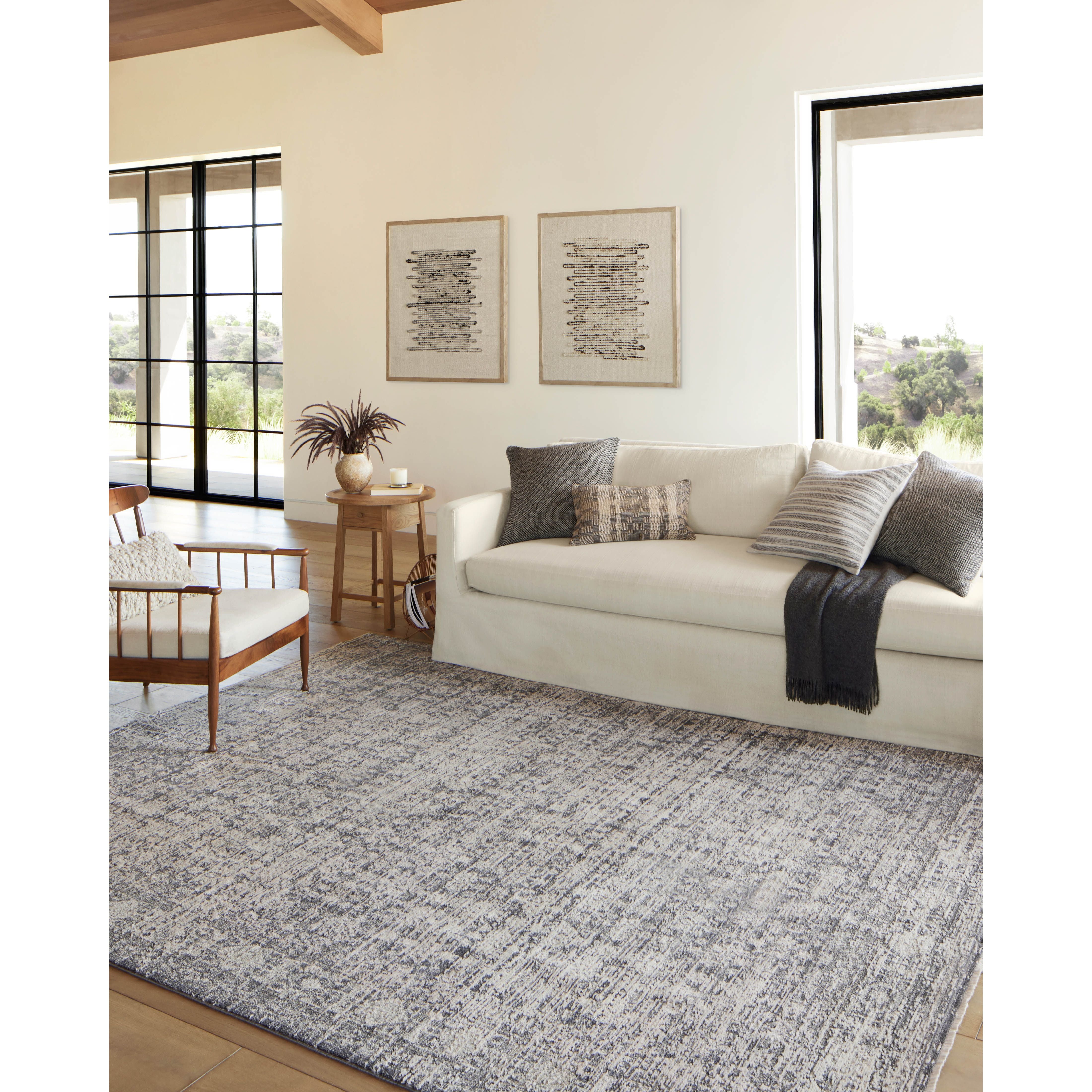 Amber Lewis x Loloi Alie Charcoal / Dove Rug have an elevated antique look and plush, modern feel. The rug’s underlying traditional motif is overlaid with a slightly higher pile that creates a softening effect like early morning fog. Amethyst Home provides interior design services, furniture, rugs, and lighting in the Austin metro area.