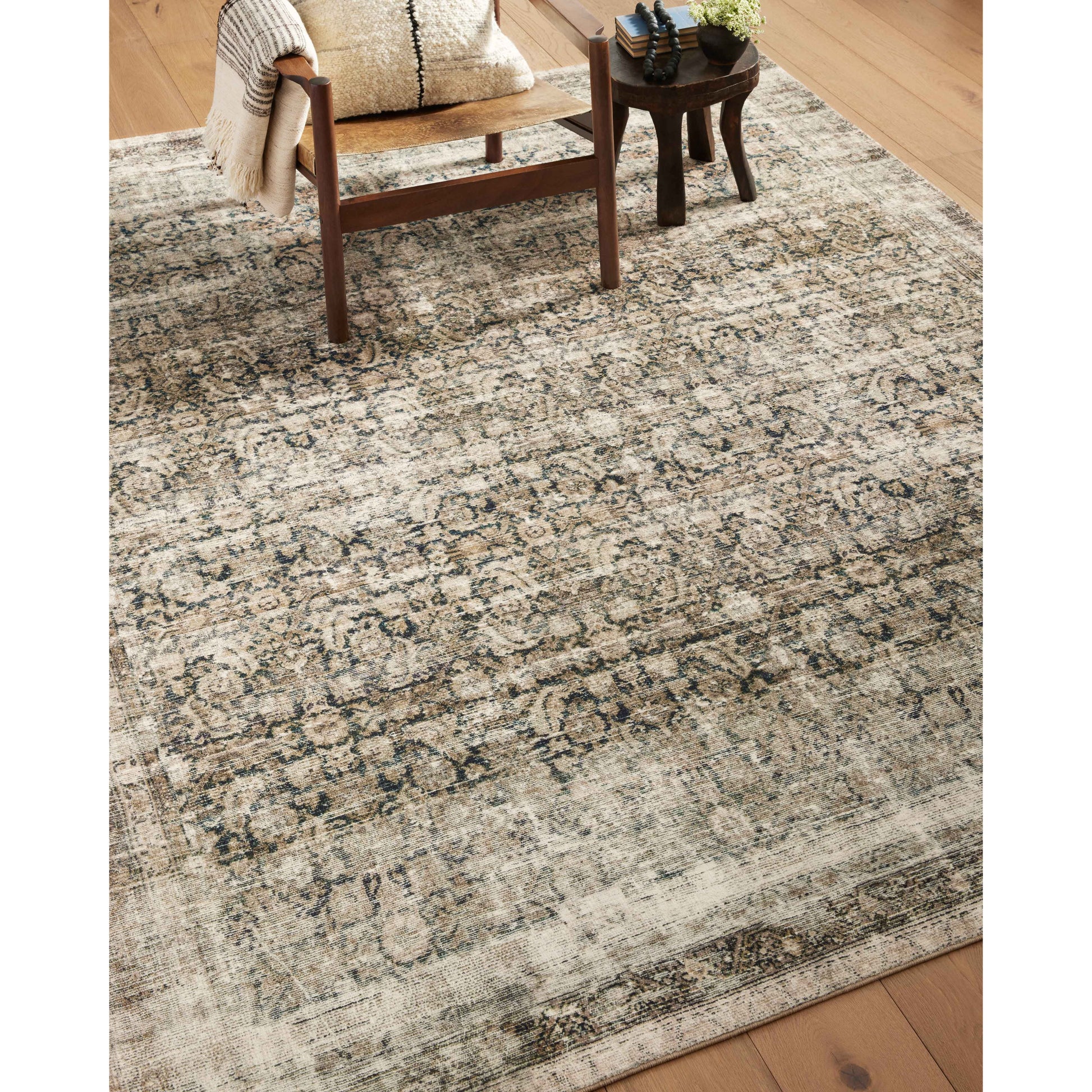With the faded feel of an antique rug, the Amber Lewis x Loloi Morgan Navy / Sand Rug is a feat of modern printed construction. These impressive area rugs expertly blend sophisticated tones to recreate the dynamic colors of a vintage textiles. Power-loomed of CloudPile™ construction, these rugs are extra-soft to walk upon yet still durable for high-traffic rooms. Amethyst Home provides interior design services, furniture, rugs, and lighting in the Miami metro area.