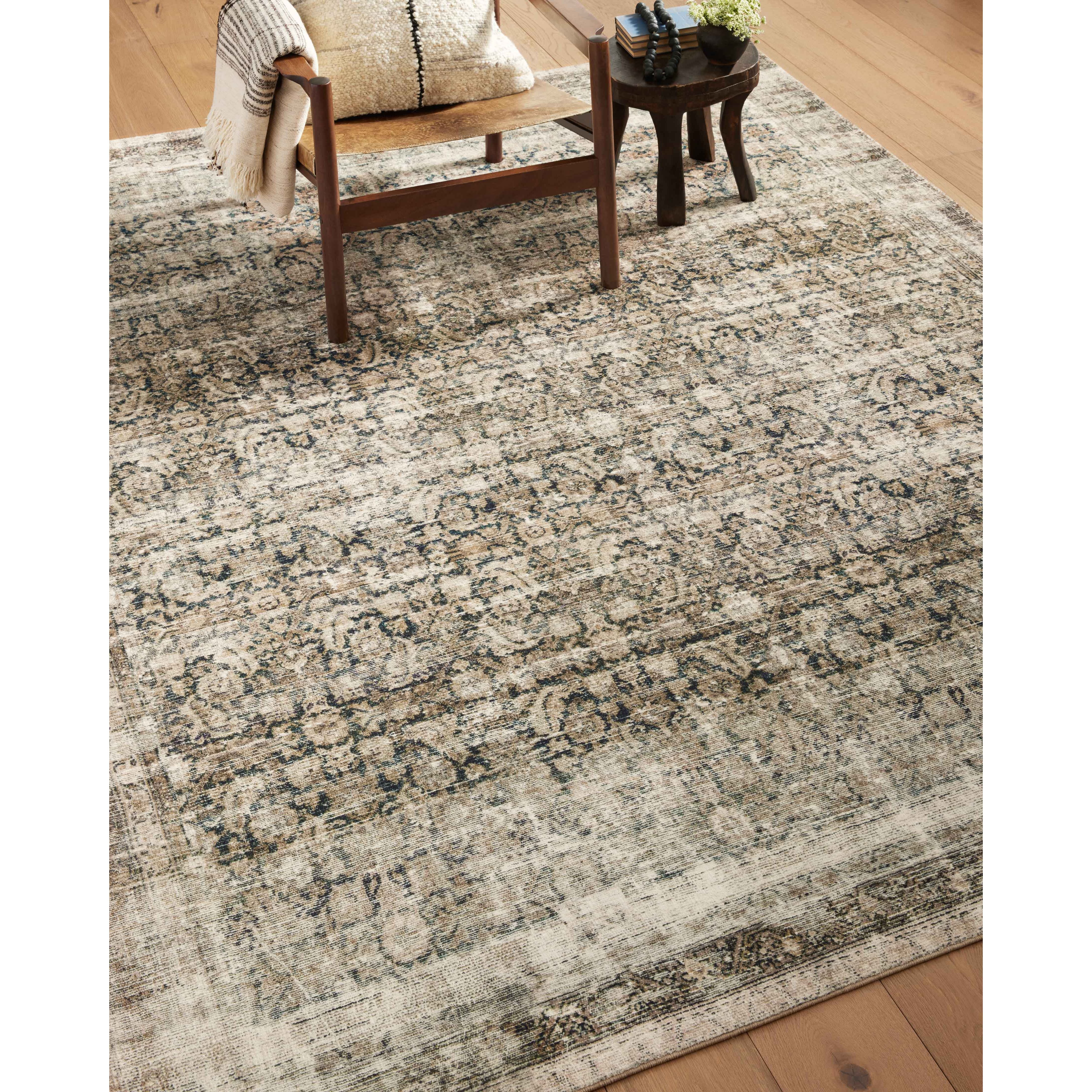 With the faded feel of an antique rug, the Amber Lewis x Loloi Morgan Navy / Sand Rug is a feat of modern printed construction. These impressive area rugs expertly blend sophisticated tones to recreate the dynamic colors of a vintage textiles. Power-loomed of CloudPile™ construction, these rugs are extra-soft to walk upon yet still durable for high-traffic rooms. Amethyst Home provides interior design services, furniture, rugs, and lighting in the Miami metro area.