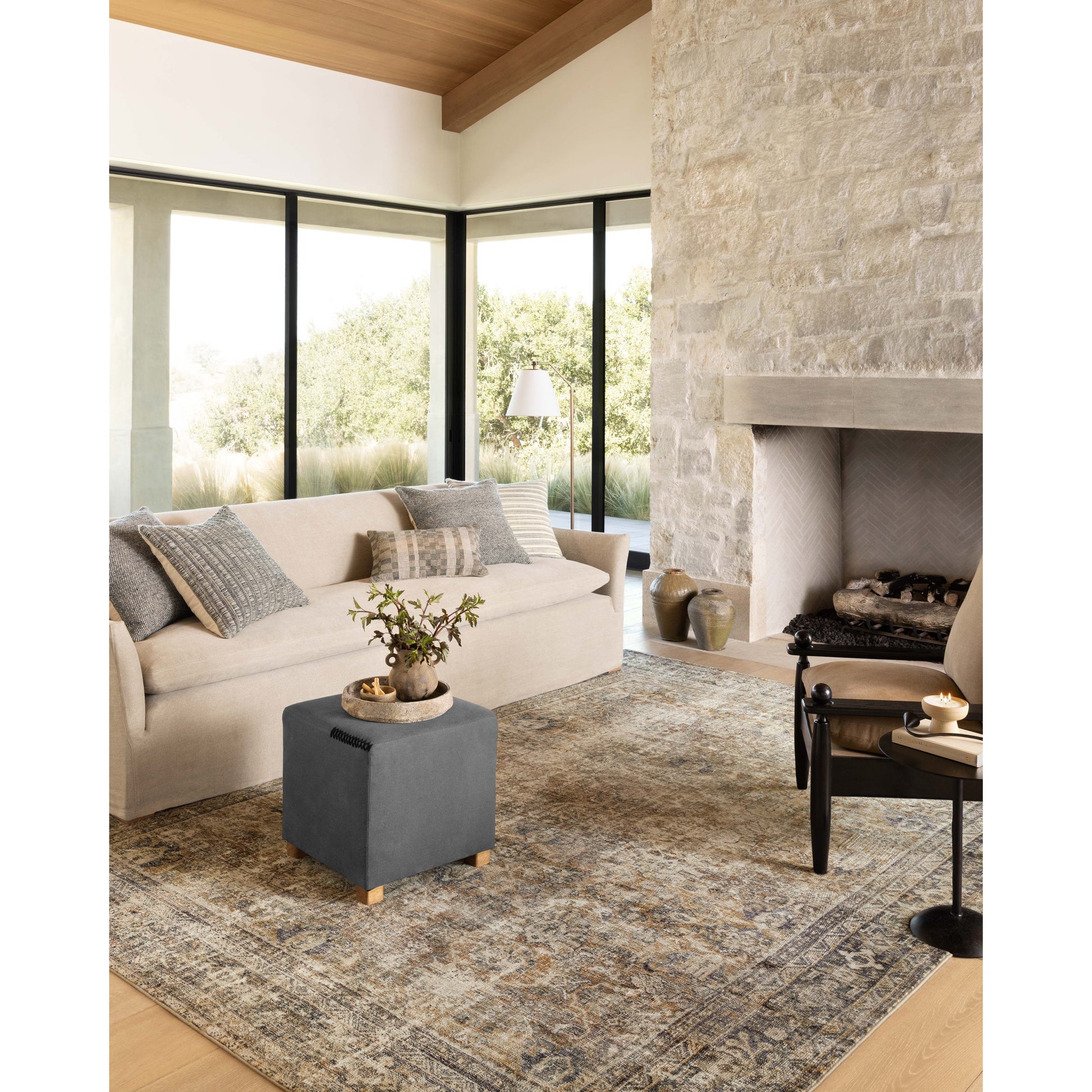 With the faded feel of an antique rug, the Amber Lewis x Loloi Morgan Sunset / Ink Rug is a feat of modern printed construction. These impressive area rugs expertly blend sophisticated tones to recreate the dynamic colors of a vintage textiles. Power-loomed of CloudPile™ construction, these rugs are extra-soft to walk upon yet still durable for high-traffic rooms. Amethyst Home provides interior design services, furniture, rugs, and lighting in the Austin metro area.