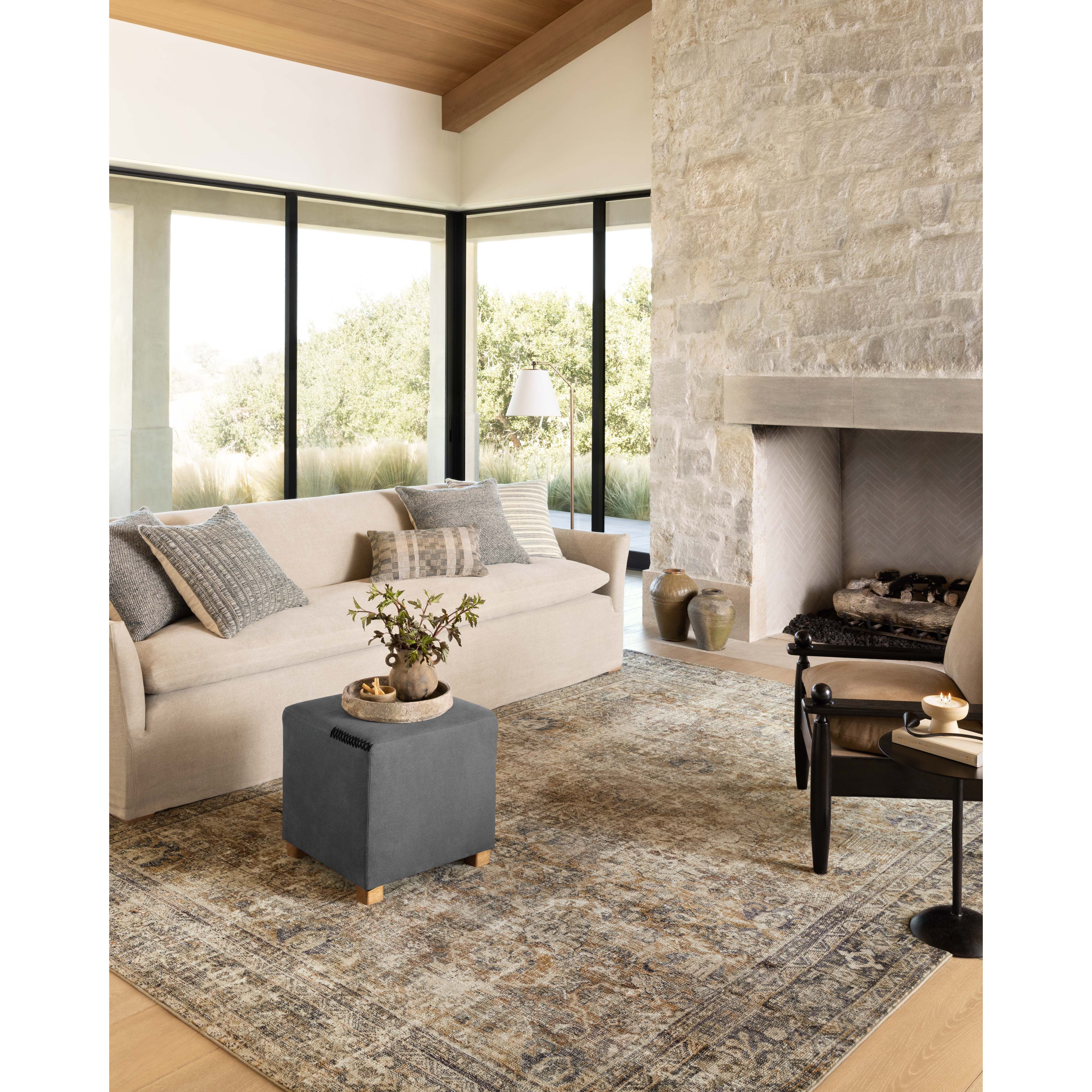 With the faded feel of an antique rug, the Amber Lewis x Loloi Morgan Sunset / Ink Rug is a feat of modern printed construction. These impressive area rugs expertly blend sophisticated tones to recreate the dynamic colors of a vintage textiles. Power-loomed of CloudPile™ construction, these rugs are extra-soft to walk upon yet still durable for high-traffic rooms. Amethyst Home provides interior design services, furniture, rugs, and lighting in the Austin metro area.
