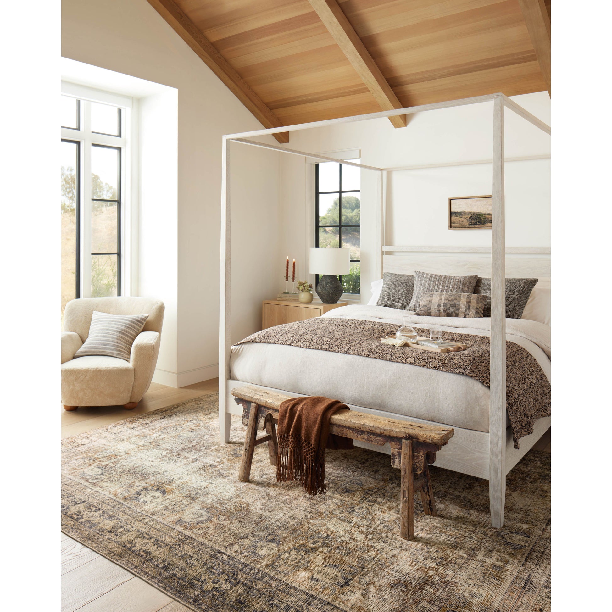 With the faded feel of an antique rug, the Amber Lewis x Loloi Morgan Sunset / Ink Rug is a feat of modern printed construction. These impressive area rugs expertly blend sophisticated tones to recreate the dynamic colors of a vintage textiles. Power-loomed of CloudPile™ construction, these rugs are extra-soft to walk upon yet still durable for high-traffic rooms. Amethyst Home provides interior design services, furniture, rugs, and lighting in the Monterey metro area.