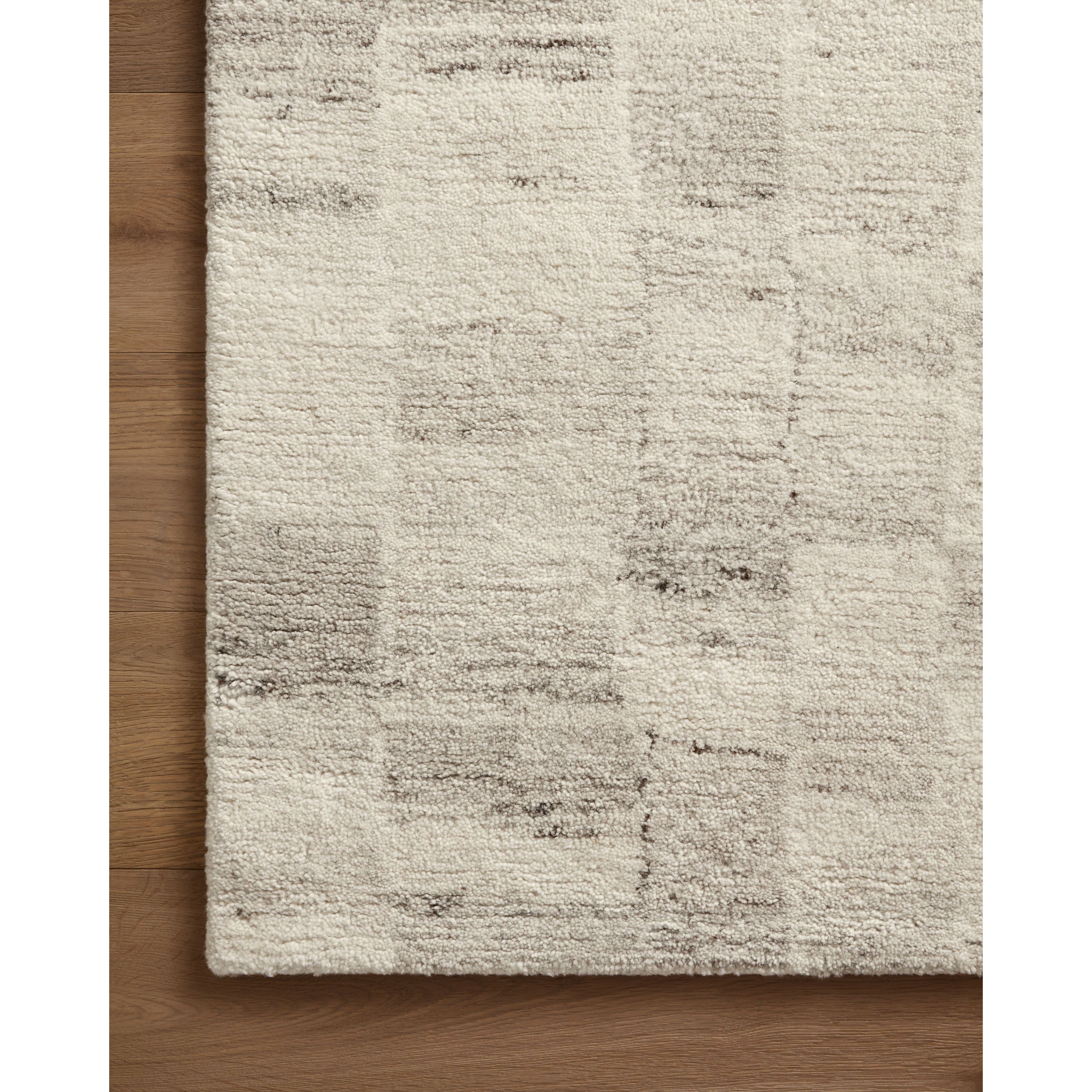 Featuring Amber Lewis x Loloi Rocky Ivory / Silver Rug by Loloi at Amethyst Home. The Rocky Collection area rug by Amber Lewis x Loloi is uniquely hand-tufted with undyed wool to create a subtle and natural color contrast. With a medium pile and neutral palette, the Rocky Collection can be a refreshing foundation in living rooms, bedrooms, and dens. The rug. Amethyst Home provides interior design, new home construction design consulting, vintage area rugs, and lighting in the Calabasas metro area.