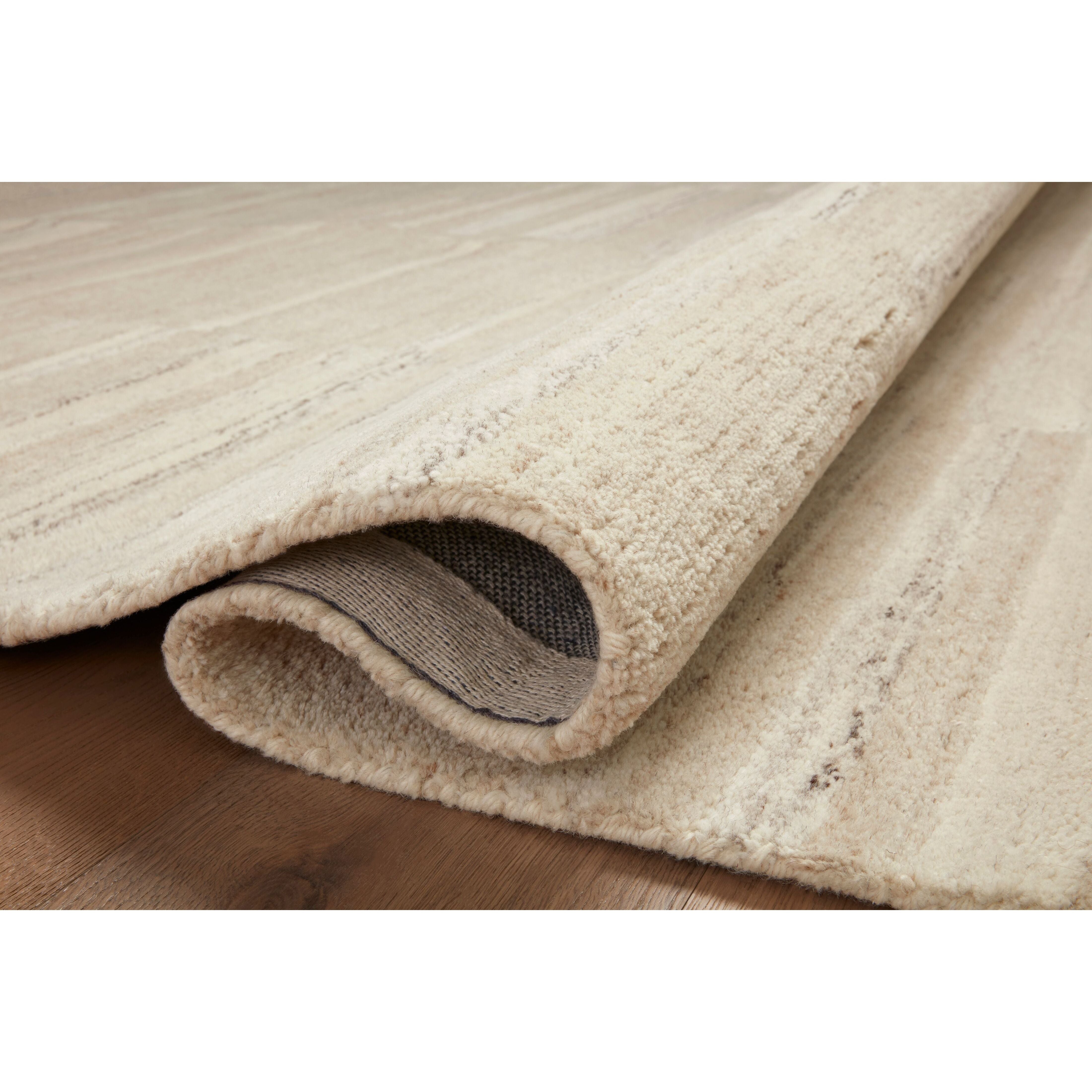 Featuring Amber Lewis x Loloi Rocky Natural / Sand Rug by Loloi at Amethyst Home. The Rocky Collection area rug by Amber Lewis x Loloi is uniquely hand-tufted with undyed wool to create a subtle and natural color contrast. With a medium pile and neutral palette, the Rocky Collection can be a refreshing foundation in living rooms, bedrooms, and dens. The ru. Amethyst Home provides interior design, new home construction design consulting, vintage area rugs, and lighting in the Scottsdale metro area.