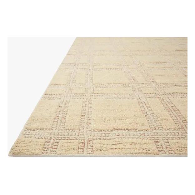 Featuring Carrier & Company x Loloi Milton Wheat / Natural Rug by Loloi at Amethyst Home. Made in collaboration with Carrier and Company x Loloi, the Milton Collection uses a banding detail to express the rich and plush pile. The addition of jute to the wool and cotton rugs creates a luxurious density that can be both seen and felt. As a simple border detai. Amethyst Home provides interior design, new home construction design consulting, vintage area rugs, and lighting in the Calabasas metro area.