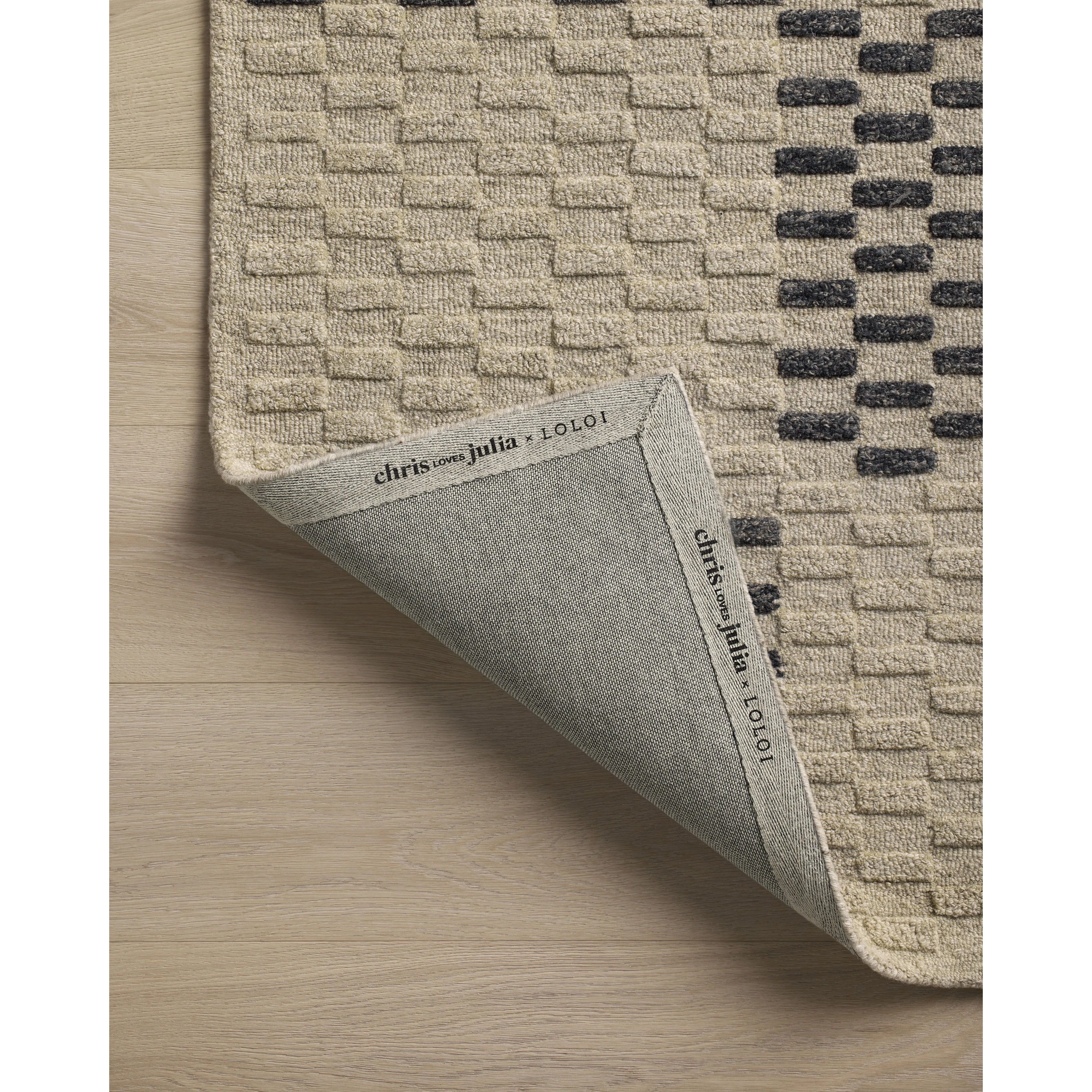 Featuring Chris Loves Julia x Loloi Bradley Beige / Midnight Rug by Loloi at Amethyst Home. The Bradley Collection from Chris Loves Julia x Loloi takes the classic striped rug to new heights. This hand-tufted, 100% wool collection features two-toned linear patterns with alternating high-low pile. Bradley is GoodWeave-certified, ensuring our commitment to e. Amethyst Home provides interior design, new home construction design consulting, vintage area rugs, and lighting in the Alpharetta metro area.