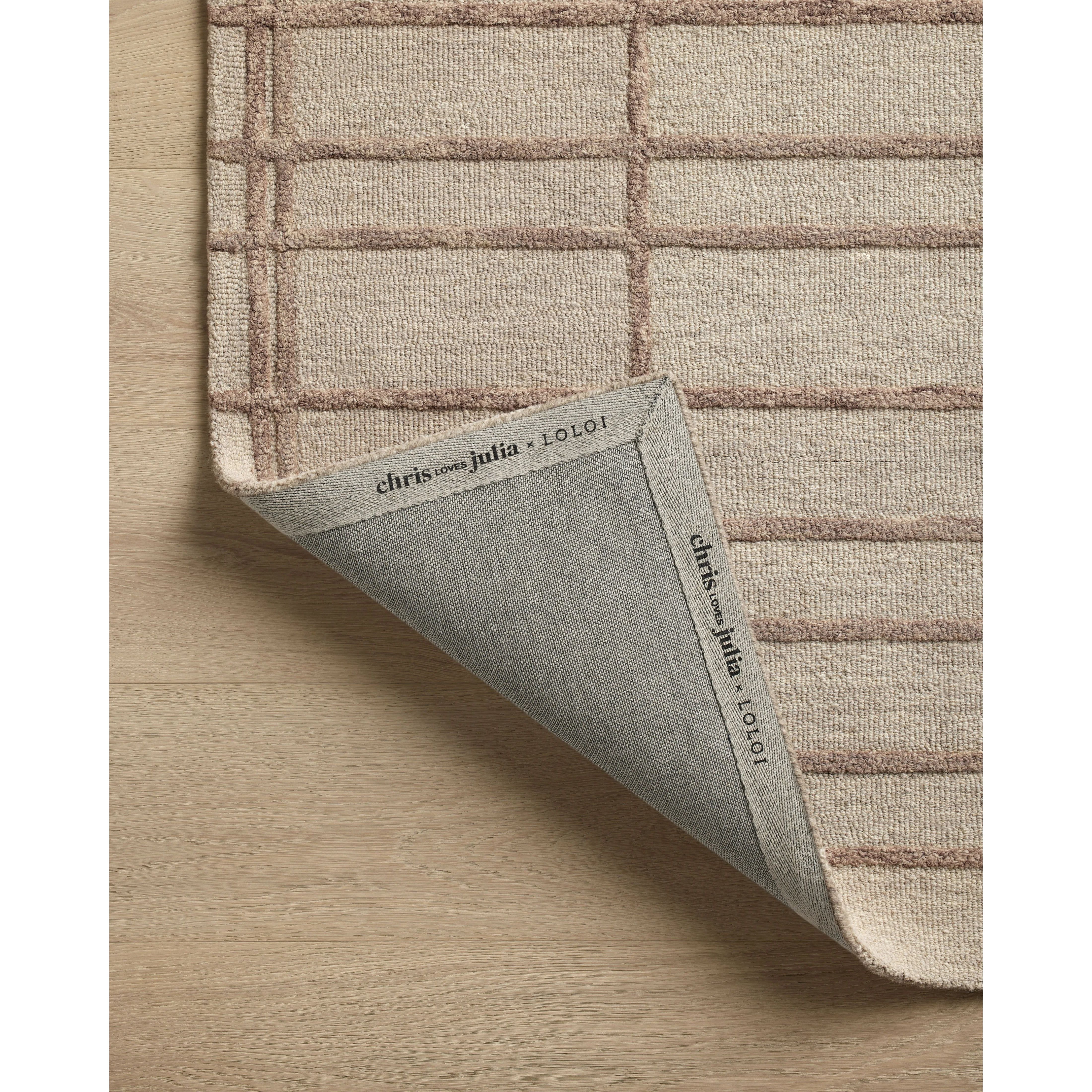 Featuring Chris Loves Julia x Loloi Bradley Rose / Blush Rug by Loloi at Amethyst Home. The Bradley Collection from Chris Loves Julia x Loloi takes the classic striped rug to new heights. This hand-tufted, 100% wool collection features two-toned linear patterns with alternating high-low pile. Bradley is GoodWeave-certified, ensuring our commitment to ethical p. Amethyst Home provides interior design, new home construction design consulting, vintage area rugs, and lighting in the Austin metro area.
