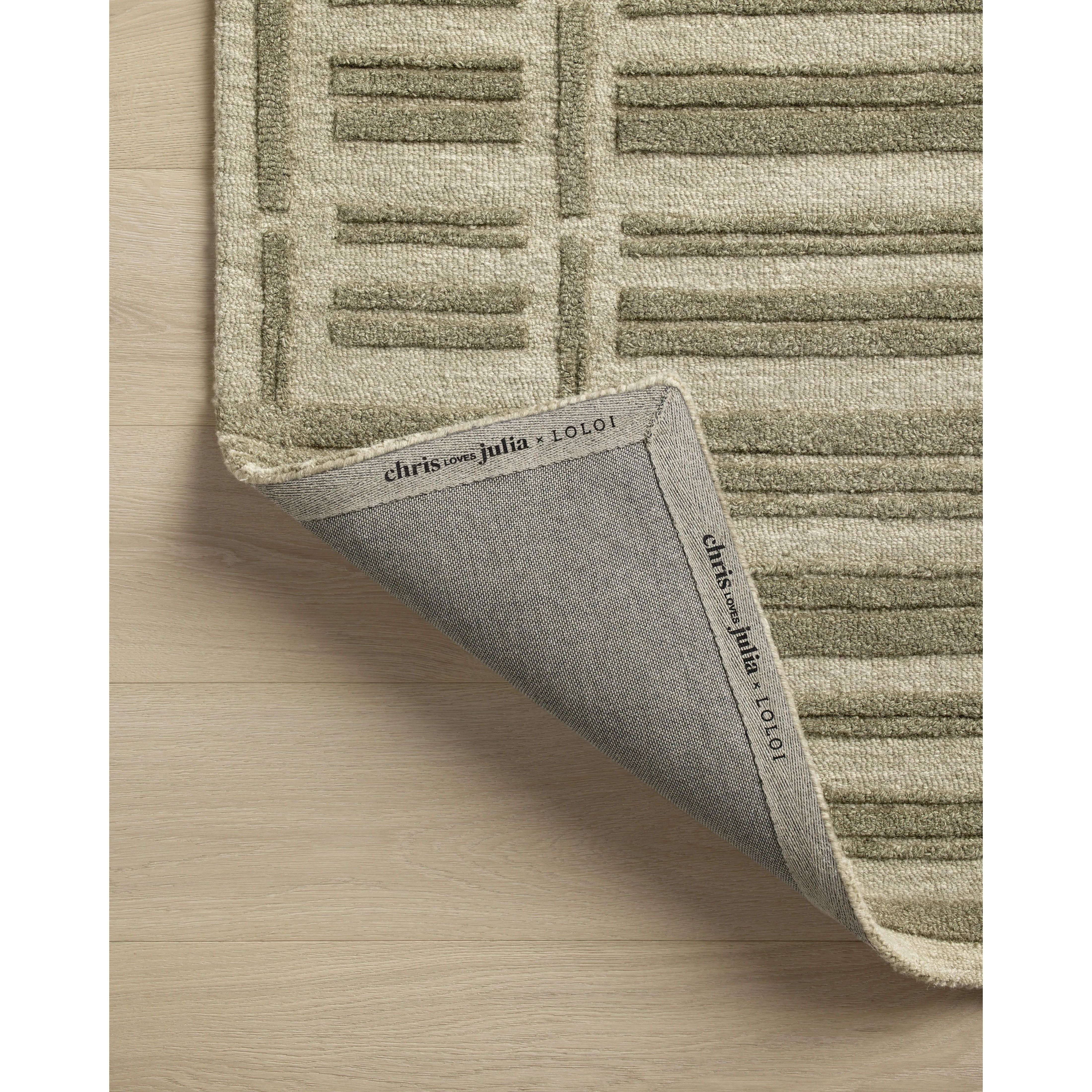 Featuring Chris Loves Julia x Loloi Bradley Sage / Olive Rug by Loloi at Amethyst Home. The Bradley Collection from Chris Loves Julia x Loloi takes the classic striped rug to new heights. This hand-tufted, 100% wool collection features two-toned linear patterns with alternating high-low pile. Bradley is GoodWeave-certified, ensuring our commitment to ethical pr. Amethyst Home provides interior design, new home construction design consulting, vintage area rugs, and lighting in the Tampa metro area.