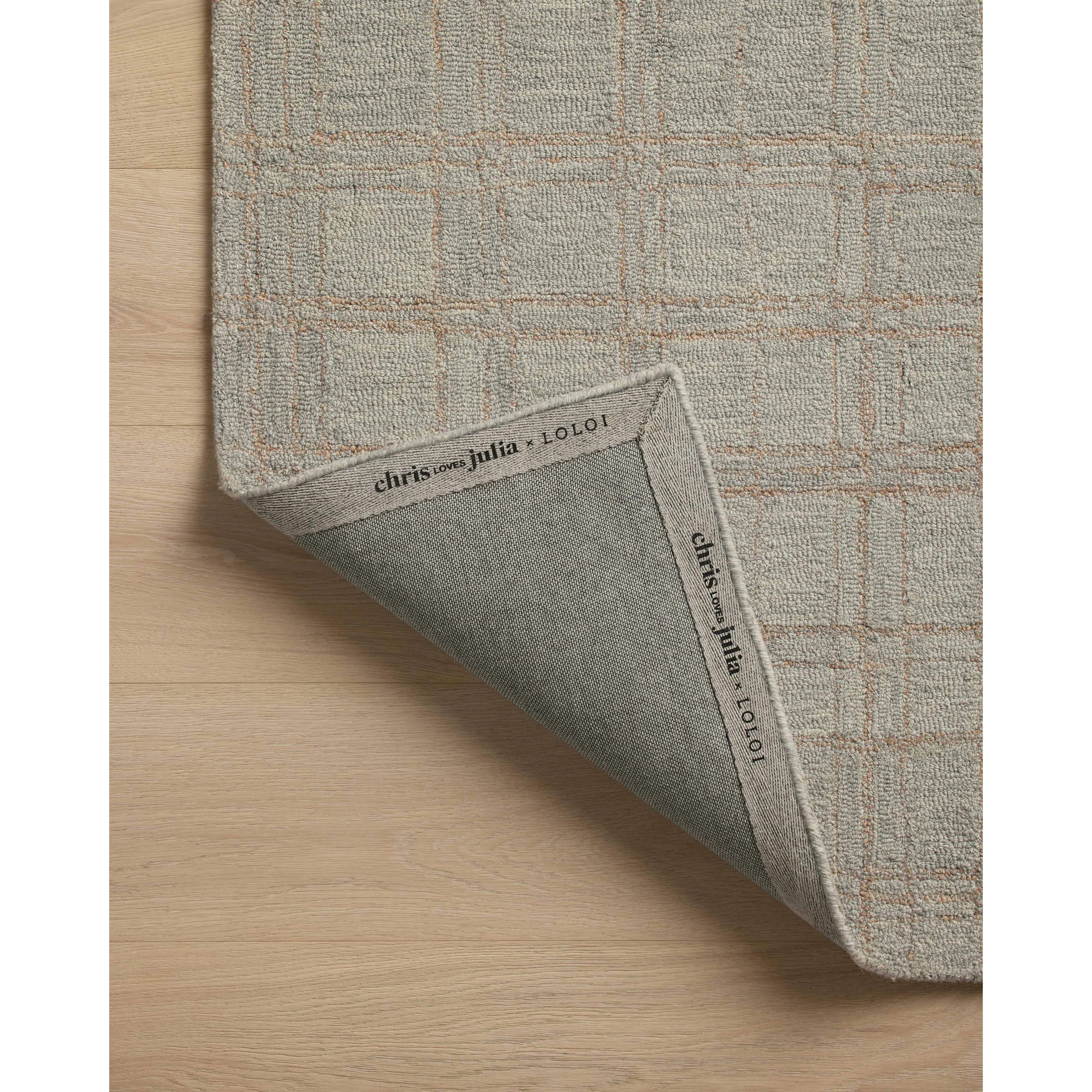 Featuring Chris Loves Julia x Loloi Polly Fog / Wheat Rug by Loloi at Amethyst Home. Hand-tufted of wool and jute pile, the Polly collection for Chris Loves Julia x Loloi brings a fresh take on modern yet classic designs. With striking gridded designs toned down by a neutral color palette, Polly is a timeless choice for any room. Polly is also GoodWeave. Amethyst Home provides interior design, new home construction design consulting, vintage area rugs, and lighting in the Newport Beach metro area.