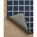 Featuring Chris Loves Julia x Loloi Polly Navy / Silver Rug by Loloi at Amethyst Home. Hand-tufted of wool and jute pile, the Polly collection for Chris Loves Julia x Loloi brings a fresh take on modern yet classic designs. With striking gridded designs toned down by a neutral color palette, Polly is a timeless choice for any room. Polly is also GoodWeave. Amethyst Home provides interior design, new home construction design consulting, vintage area rugs, and lighting in the Kansas City metro area.