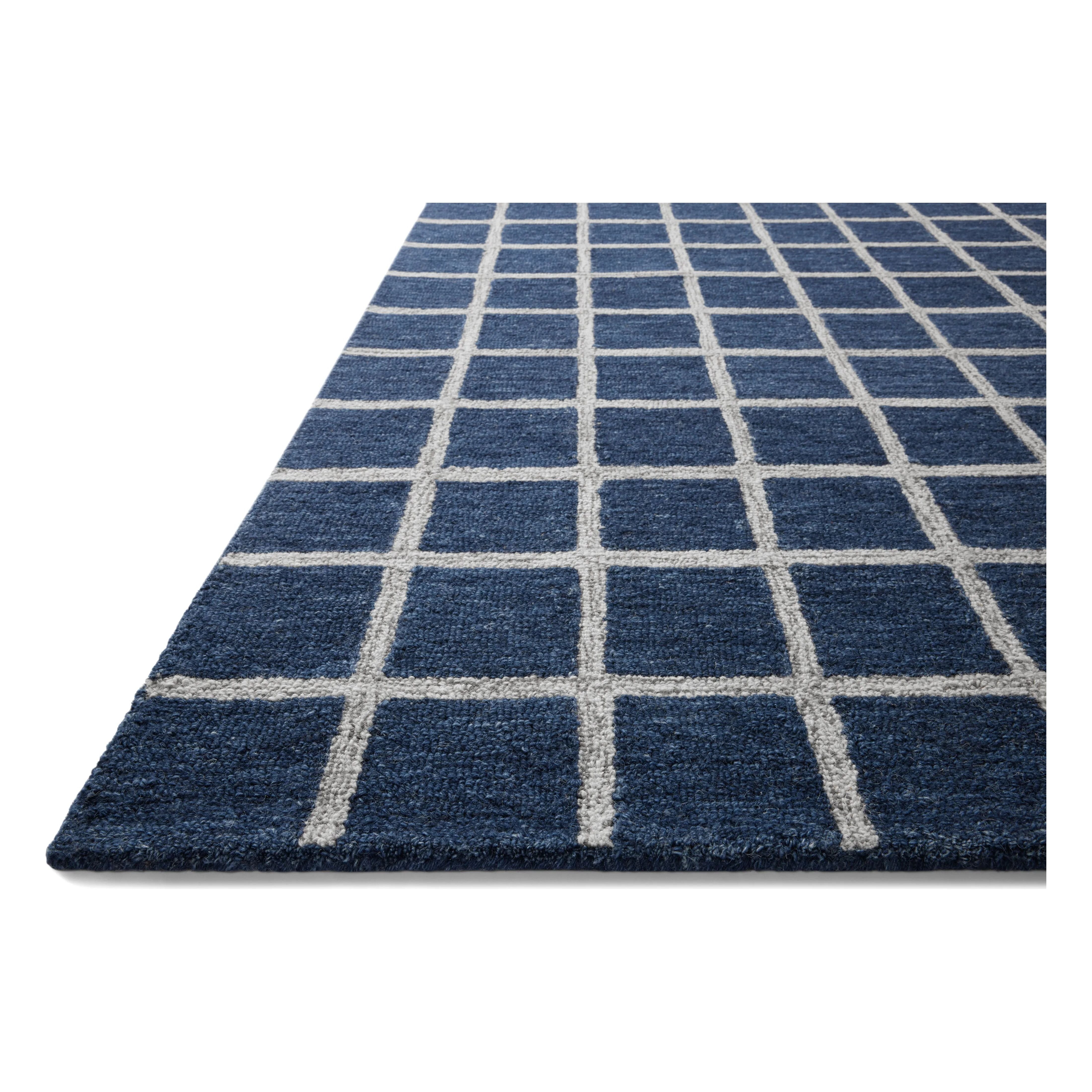 Featuring Chris Loves Julia x Loloi Polly Navy / Silver Rug by Loloi at Amethyst Home. Hand-tufted of wool and jute pile, the Polly collection for Chris Loves Julia x Loloi brings a fresh take on modern yet classic designs. With striking gridded designs toned down by a neutral color palette, Polly is a timeless choice for any room. Polly is also GoodWeave. Amethyst Home provides interior design, new home construction design consulting, vintage area rugs, and lighting in the Los Angeles metro area.