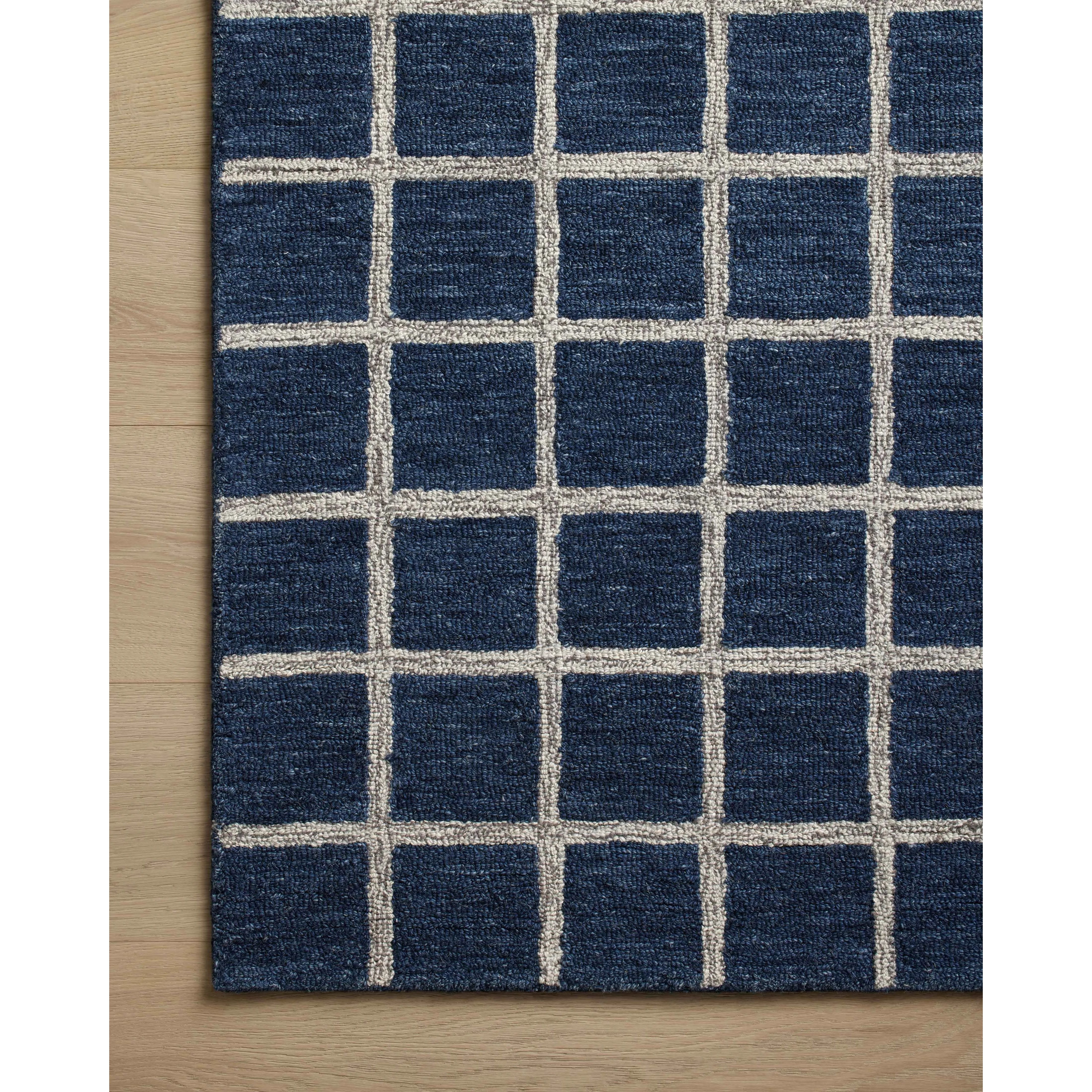 Featuring Chris Loves Julia x Loloi Polly Navy / Silver Rug by Loloi at Amethyst Home. Hand-tufted of wool and jute pile, the Polly collection for Chris Loves Julia x Loloi brings a fresh take on modern yet classic designs. With striking gridded designs toned down by a neutral color palette, Polly is a timeless choice for any room. Polly is also GoodWeave ce. Amethyst Home provides interior design, new home construction design consulting, vintage area rugs, and lighting in the Portland metro area.