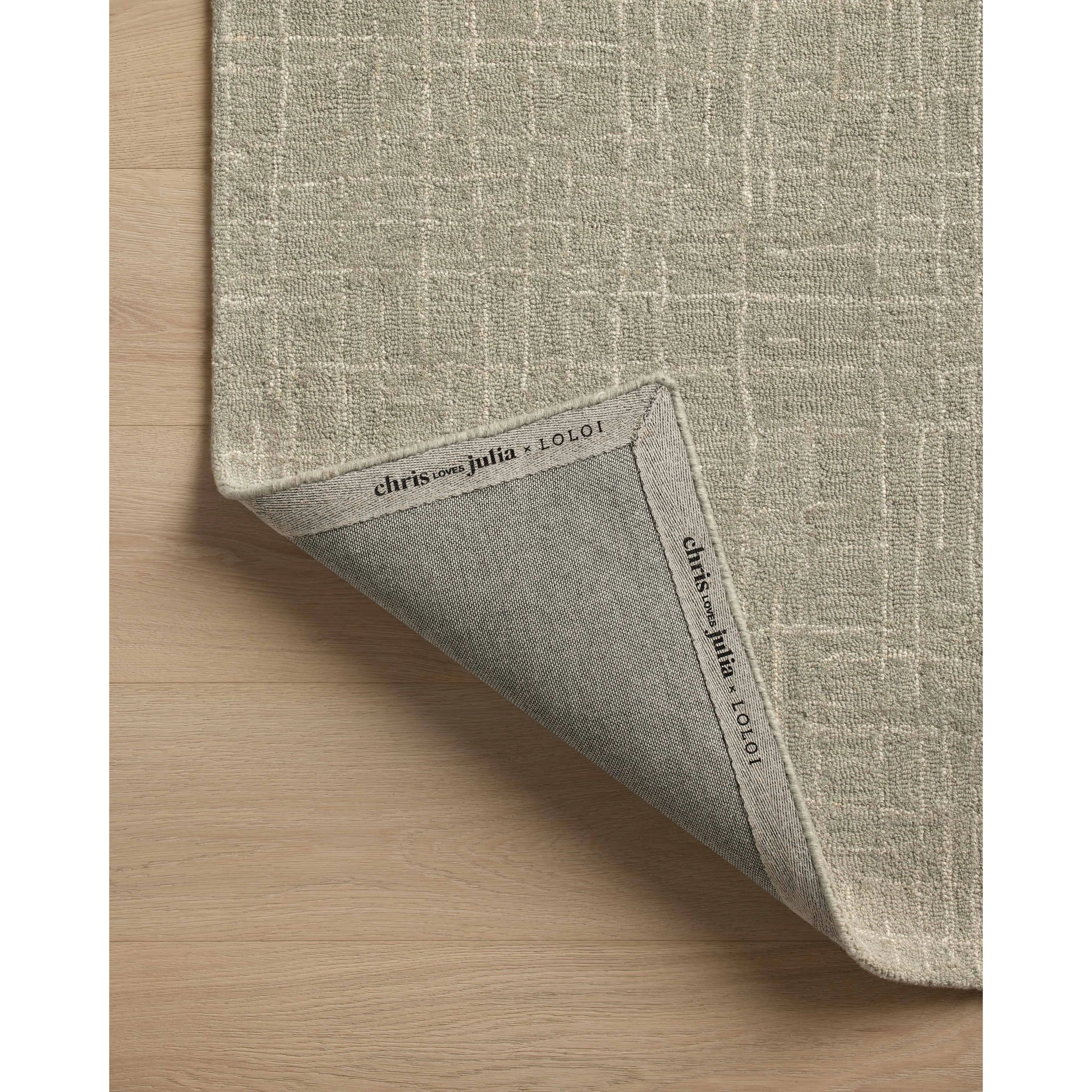 Featuring Chris Loves Julia x Loloi Polly Spa / Ivory Rug by Loloi at Amethyst Home. Hand-tufted of wool and jute pile, the Polly collection for Chris Loves Julia x Loloi brings a fresh take on modern yet classic designs. With striking gridded designs toned down by a neutral color palette, Polly is a timeless choice for any room. Polly is also GoodWeave cer. Amethyst Home provides interior design, new home construction design consulting, vintage area rugs, and lighting in the Nashville metro area.