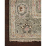The Helena Sage / Sunset HEL-03 rug from Loloi is hand-knotted of 100% wool, refined, yet versatile for any home. The Helena rug combines weathered tones and worldly patterns for a beautiful grounding element in any room. Amethyst Home provides interior design, new construction, custom furniture, and rugs for the Des Moines and Cedar Rapids metro area.