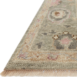 The Helena Sage / Sunset HEL-03 rug from Loloi is hand-knotted of 100% wool, refined, yet versatile for any home. The Helena rug combines weathered tones and worldly patterns for a beautiful grounding element in any room. Amethyst Home provides interior design, new construction, custom furniture, and rugs for the Kansas City metro area.