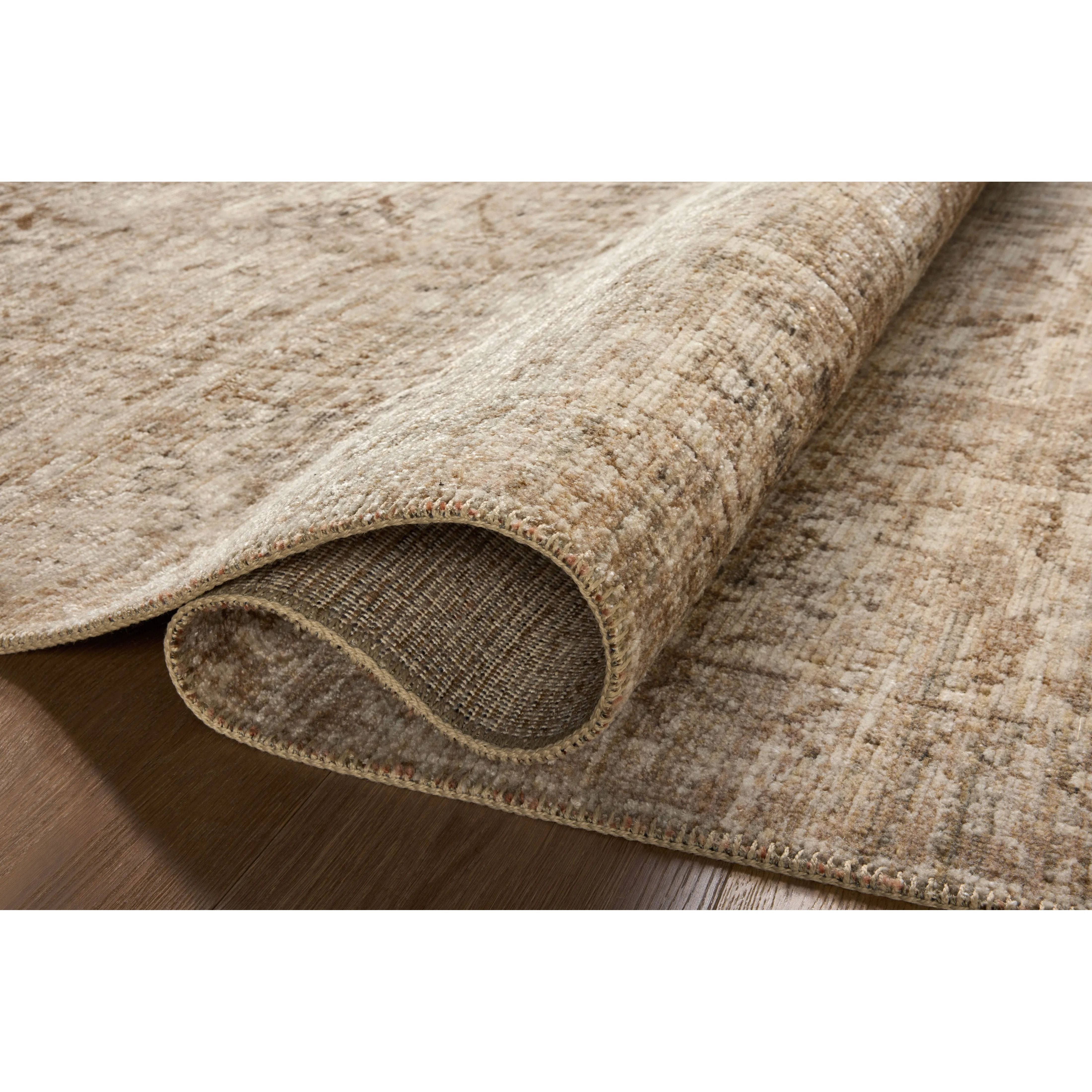 Featuring Heritage Ivory / Natural Rug by Loloi at Amethyst Home. Heritage is Loloi’s best collection yet. Inspired by Amir Loloi’s favorite vintage rugs, the collection recreates a vintage aesthetic and variable-pile texture using a new craft process that was invented specifically for this rug—a process that took over two years to complete. Motifs in Heri. Amethyst Home provides interior design, new home construction design consulting, vintage area rugs, and lighting in the Alpharetta metro area.
