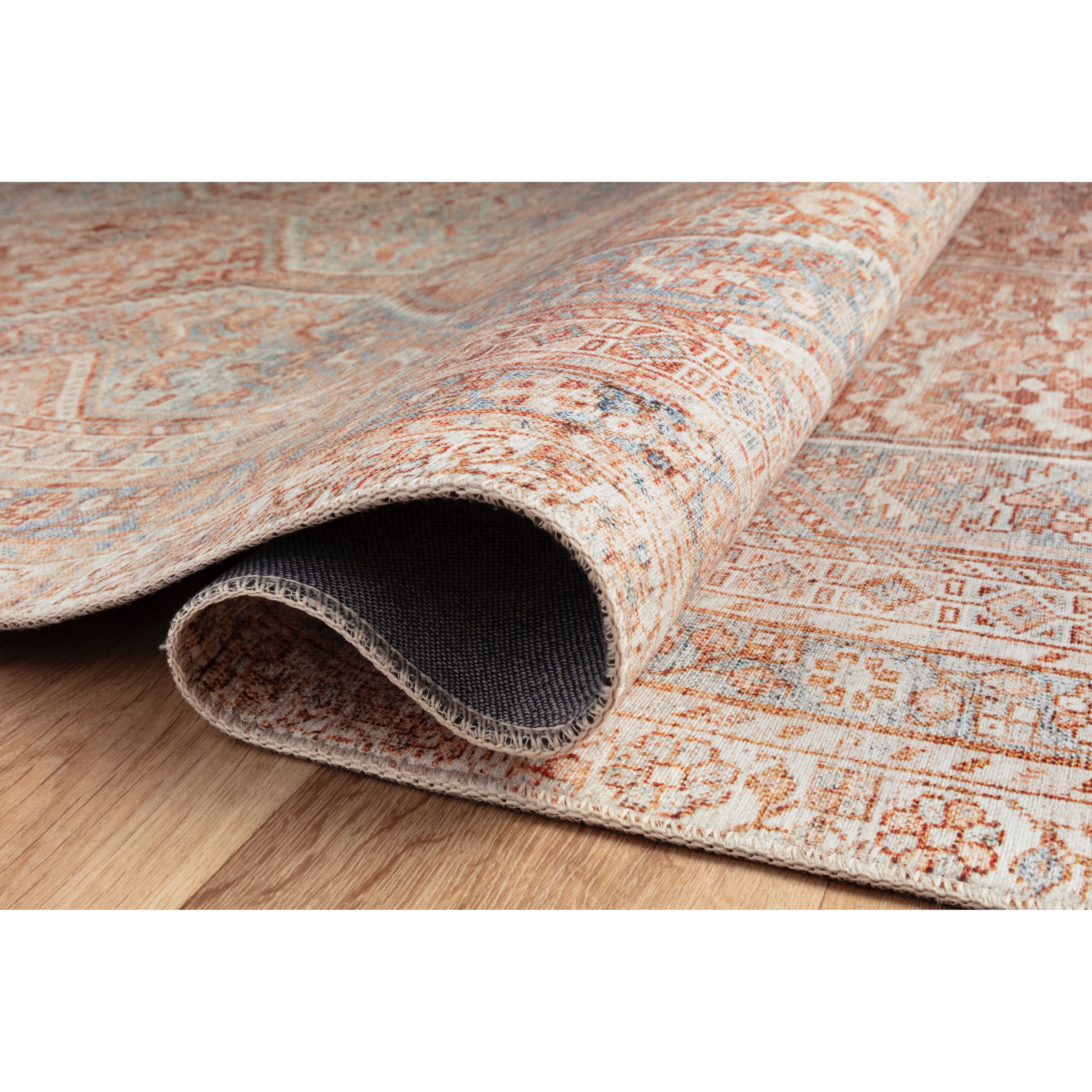 Durable, low pile, and soft underfoot, this rug is inspired by classic vintage and antique rugs. The Jules Chris Loves Julia Tangerine / Mist rug from Loloi features a beautiful vintage pattern and patina. The rug is easy to clean and maintain and perfect for living rooms, dining rooms, hallways, and kitchens!