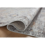 Featuring Monroe Sky / Gold Rug by Loloi at Amethyst Home. Inspired by antique Turkish Oushak carpets with large-scale motifs, the Monroe Sky / Gold Rug modernizes the traditional design in neutral palettes, many of which have black details that anchor the rug in the room. Monroe is power-loomed of 100% polypropylene for easy care and reliable durability. . Amethyst Home provides interior design, new home construction design consulting, vintage area rugs, and lighting in the Washington metro area.
