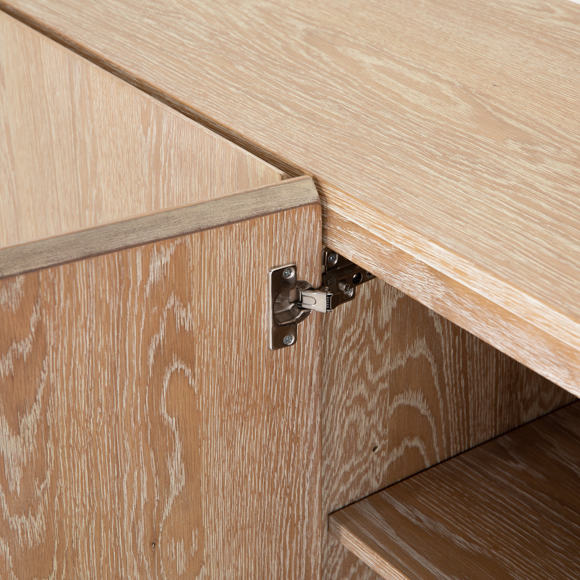 We love the grained matte finish on this Mika Washed Oak Veneer Dining Sideboard. The shelves make this the perfect sideboard for a functional, modernly attractive piece to add to your dining room  Size:  72.00"w x 16.00"d x 30.00"h Materials: Oak Veneer