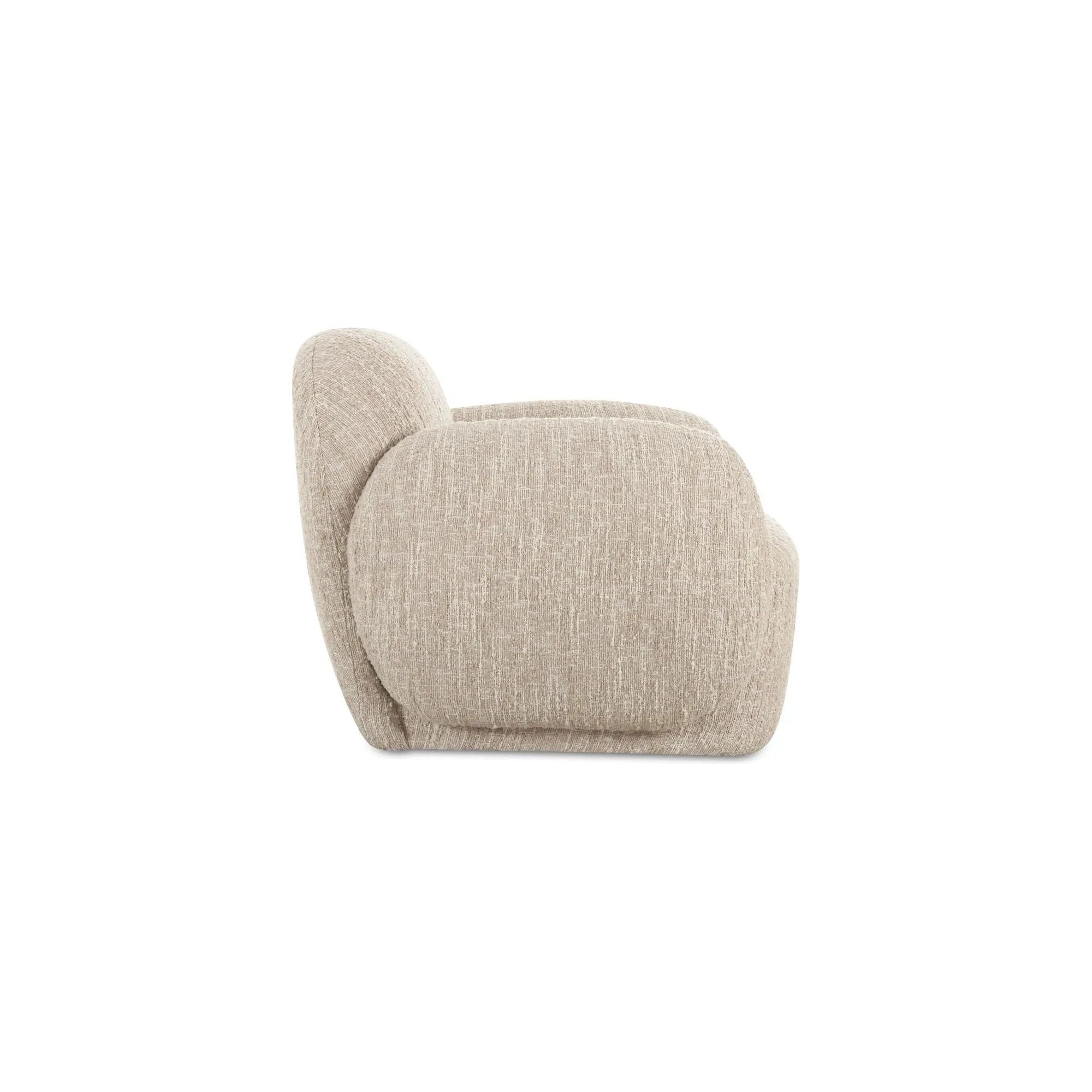 The Hazel lounge chair embraces minimalist, understated elegance with its low-profile, modernist silhouette. Wrapped in exaggerated boucle fabric, it offers a distinct tactility and comfort. The bold, curved arm design makes a stylish statement, harmonizing with the sleek form to create an inviting focal point in any setting Amethyst Home provides interior design, new home construction design consulting, vintage area rugs, and lighting in the Seattle metro area.