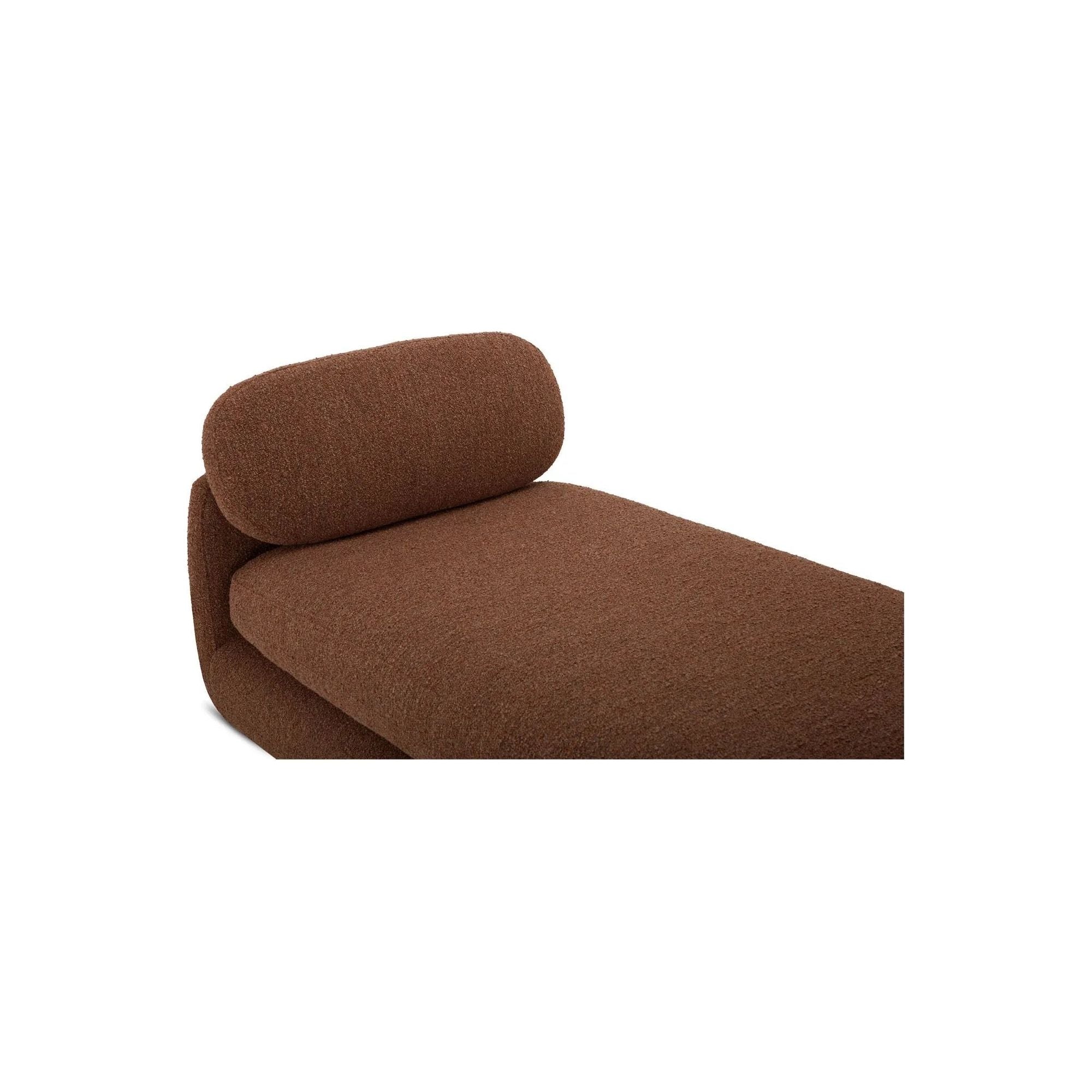 Inspired by the captivating styles of the 70s, the Scout daybed brings a piece of the past into the present. Clad in textured bouclé fabric, the chair merges visual allure and tactility. Its curved form, combined with a rounded and elongated cushion, introduces a touch of softness to any space, while the plump seat cushion promises modern comfort Amethyst Home provides interior design, new home construction design consulting, vintage area rugs, and lighting in the Seattle metro area.