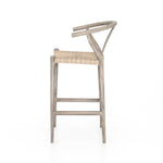 Modern curves redefine the classic wishbone-style counter stool. Vintage white all-weather wicker is woven for a dose of fresh texture within weathered grey teak framing. Cover or store indoors during inclement weather and when not in use. Amethyst Home provides interior design, new home construction design consulting, vintage area rugs, and lighting in the Nashville metro area.