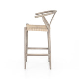 Modern curves redefine the classic wishbone-style counter stool. Vintage white all-weather wicker is woven for a dose of fresh texture within weathered grey teak framing. Cover or store indoors during inclement weather and when not in use. Amethyst Home provides interior design, new home construction design consulting, vintage area rugs, and lighting in the Nashville metro area.