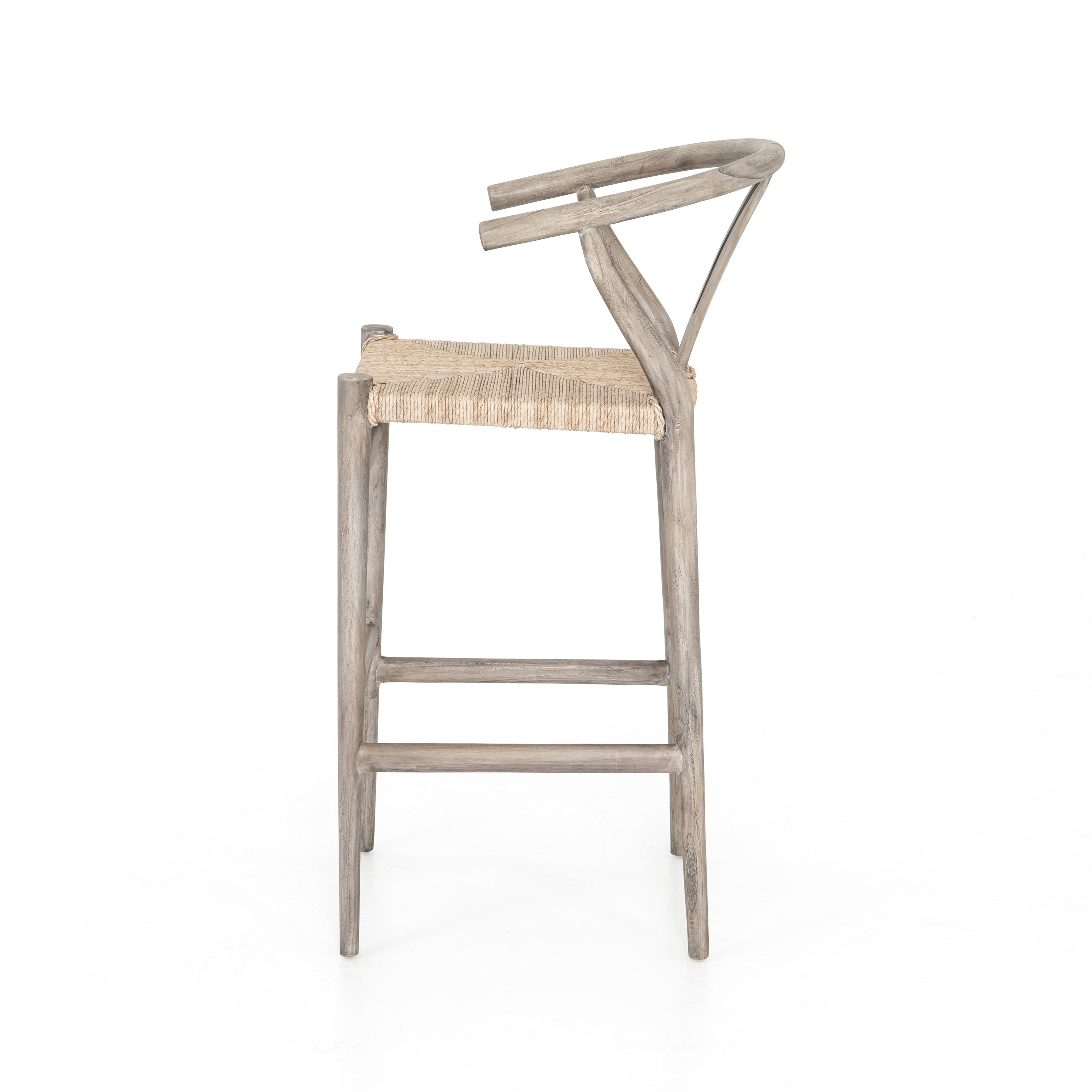 Modern curves redefine the classic wishbone-style counter stool. Vintage white all-weather wicker is woven for a dose of fresh texture within weathered grey teak framing. Cover or store indoors during inclement weather and when not in use. Amethyst Home provides interior design, new home construction design consulting, vintage area rugs, and lighting in the Nashville metro area.