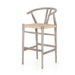 Modern curves redefine the classic wishbone-style counter stool. Vintage white all-weather wicker is woven for a dose of fresh texture within weathered grey teak framing. Cover or store indoors during inclement weather and when not in use. Amethyst Home provides interior design, new home construction design consulting, vintage area rugs, and lighting in the Park City metro area.