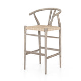 Modern curves redefine the classic wishbone-style counter stool. Vintage white all-weather wicker is woven for a dose of fresh texture within weathered grey teak framing. Cover or store indoors during inclement weather and when not in use. Amethyst Home provides interior design, new home construction design consulting, vintage area rugs, and lighting in the Park City metro area.