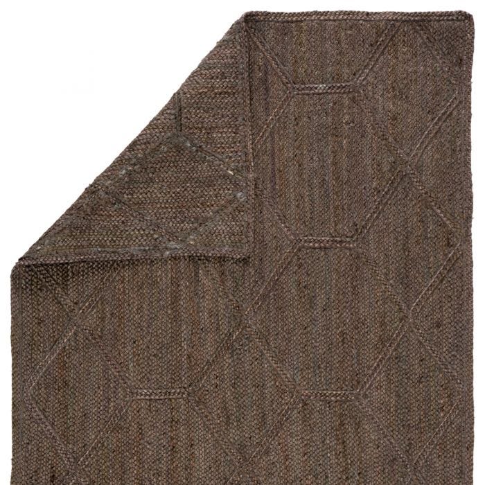 The Naturals Tobago collection delivers rich texture and organic allure to contemporary homes. Handwoven of jute, the Ponce area rug showcases a chic geometric trellis design. The mix of gray, taupe, and brown hues lend a deep natural tone to ground any space.  Handwoven  100% Jute  NAT42 Naturals Tobago Ponce Rug